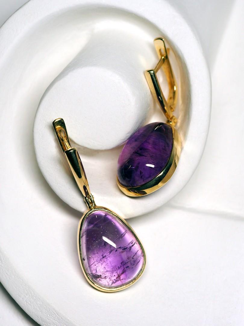 14K yellow gold earrings with natural amethyst cabochon
amethyst origin - Morocco
amethyst weight - 28.15 carats
earrings weight - 10.6 grams
earrings length - 1.57 in / 40 mm
stone measurements - 0.28 х 0.51 x 0.67 in / 7 х 13 х 17 mm


We ship our