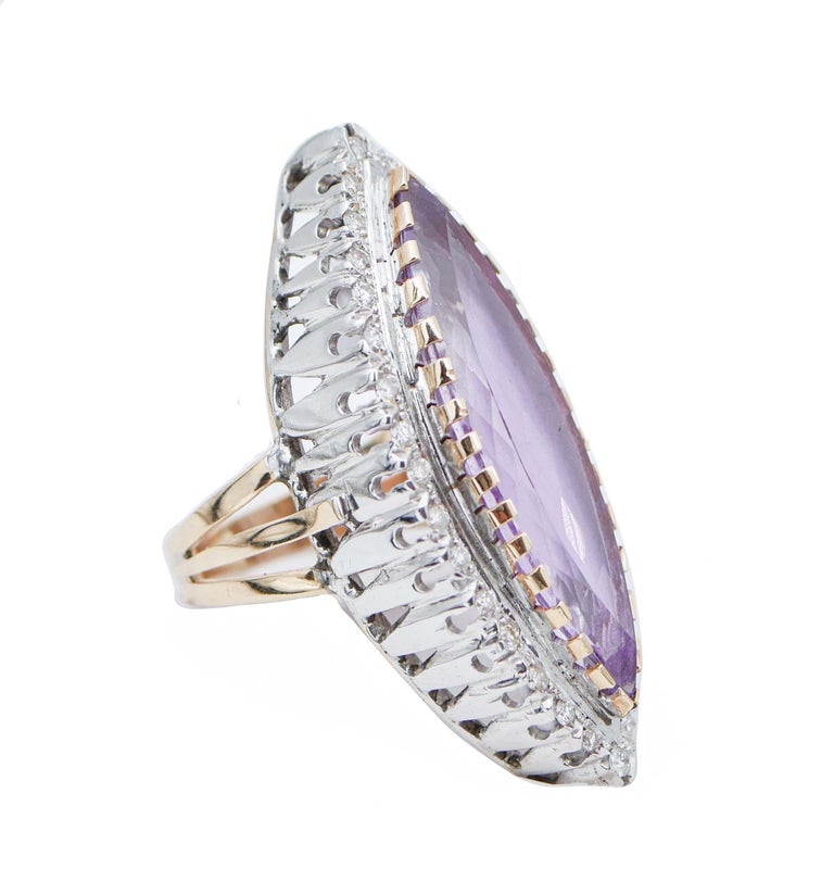 SHIPPING POLICY:
No additional costs will be added to this order.
Shipping costs will be totally covered by the seller (customs duties included).

Particula ring in 14 kt white and rose gold structure mounted with a central amethyst surrounded by