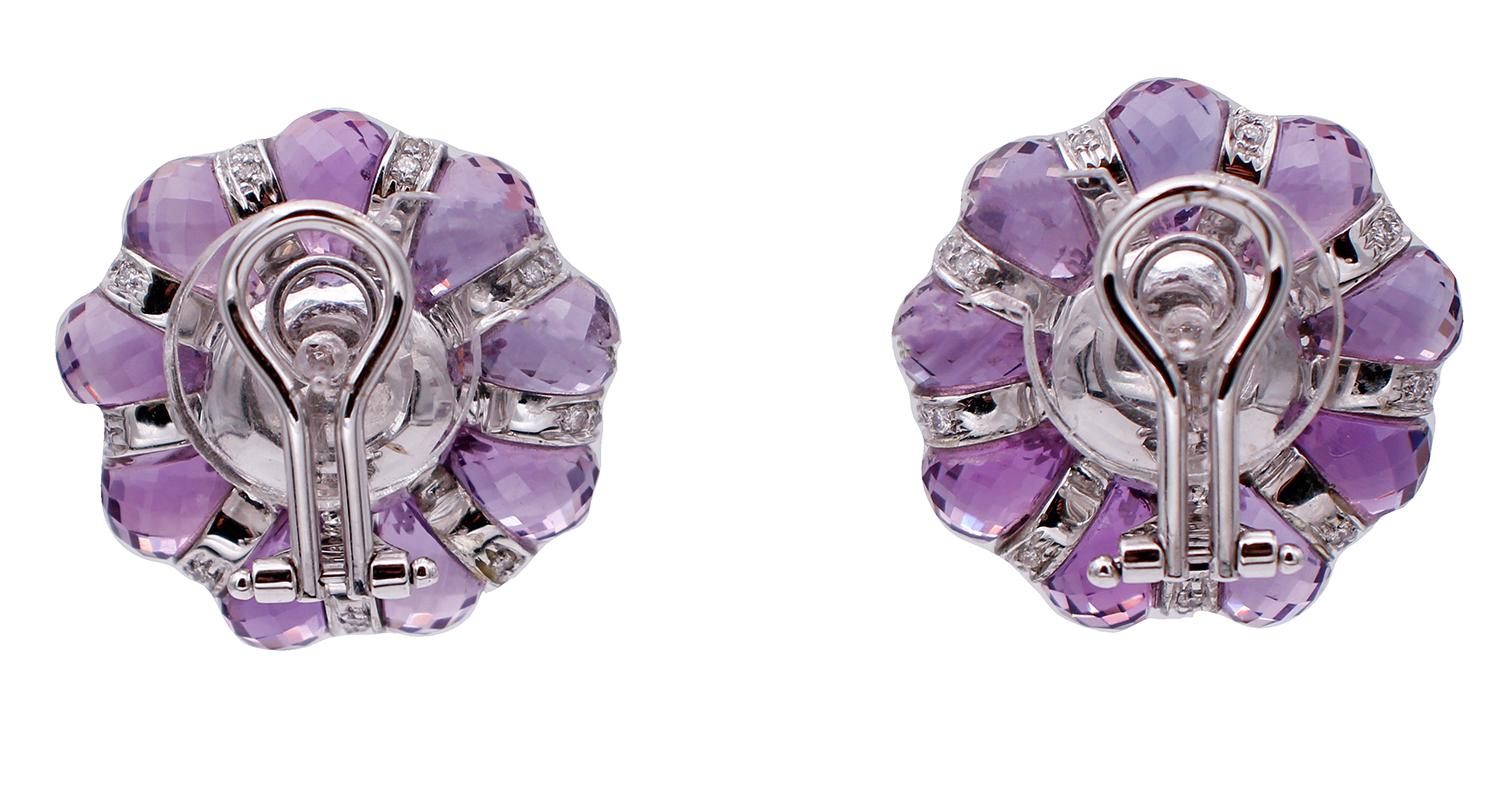 Beautiful stud earrings in 18 karat white gold structure mounted with a central pink coral surrounded by amethyst and diamonds.
These earrings were totally handmade by Italian master goldsmiths and they are in perfect conditions.
Diamonds 1.10