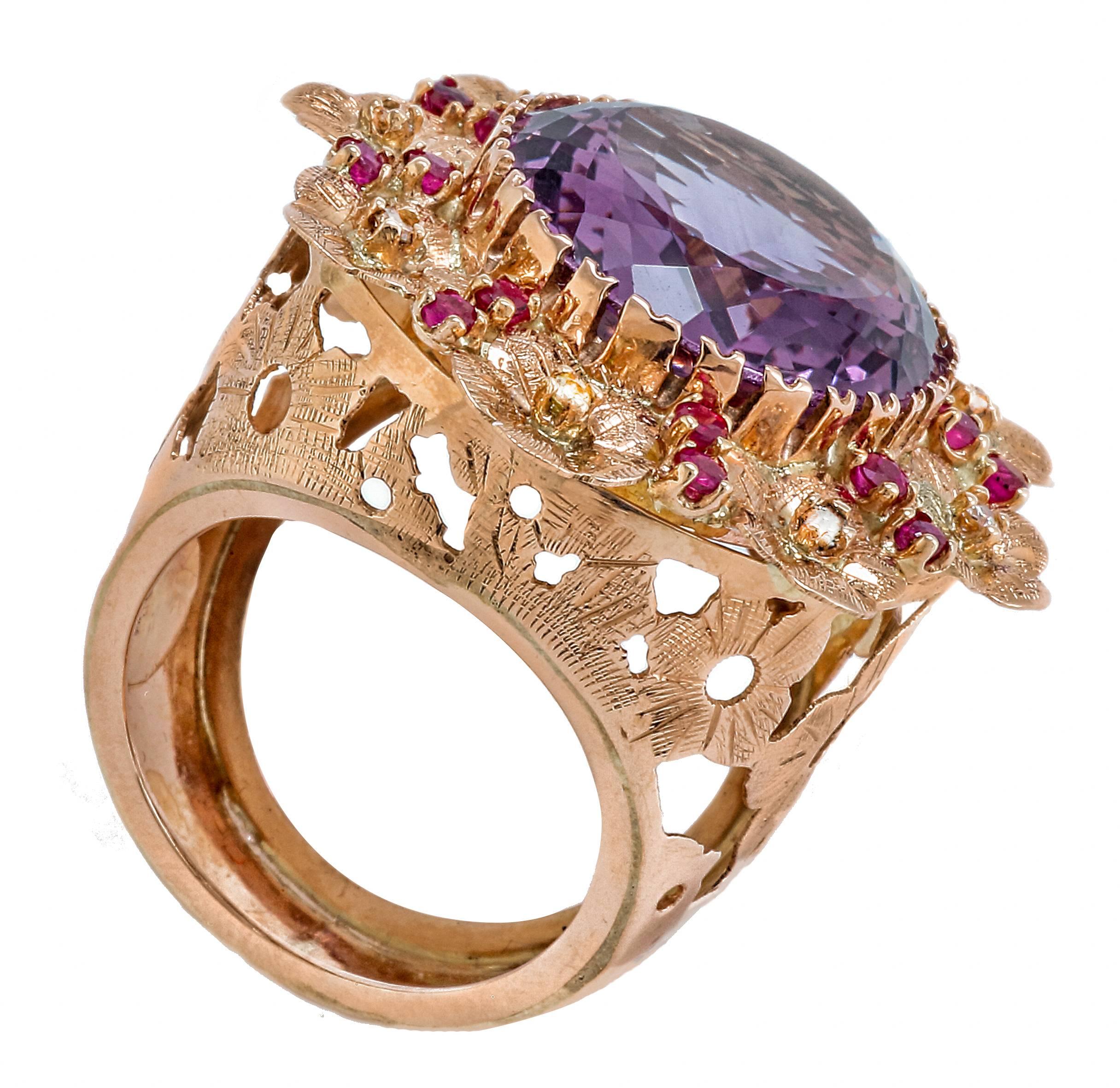Beautiful ring in 14 kt rose gold, flowers pierced on the stem and small flowers embellished with diamonds of ct 0.21 and rubies of ct 0.88 that all rotate intono to a fabulous amethyst of ct 17.81. Total weight g 14.9
Diamonds ct 0.21
Amethyst ct