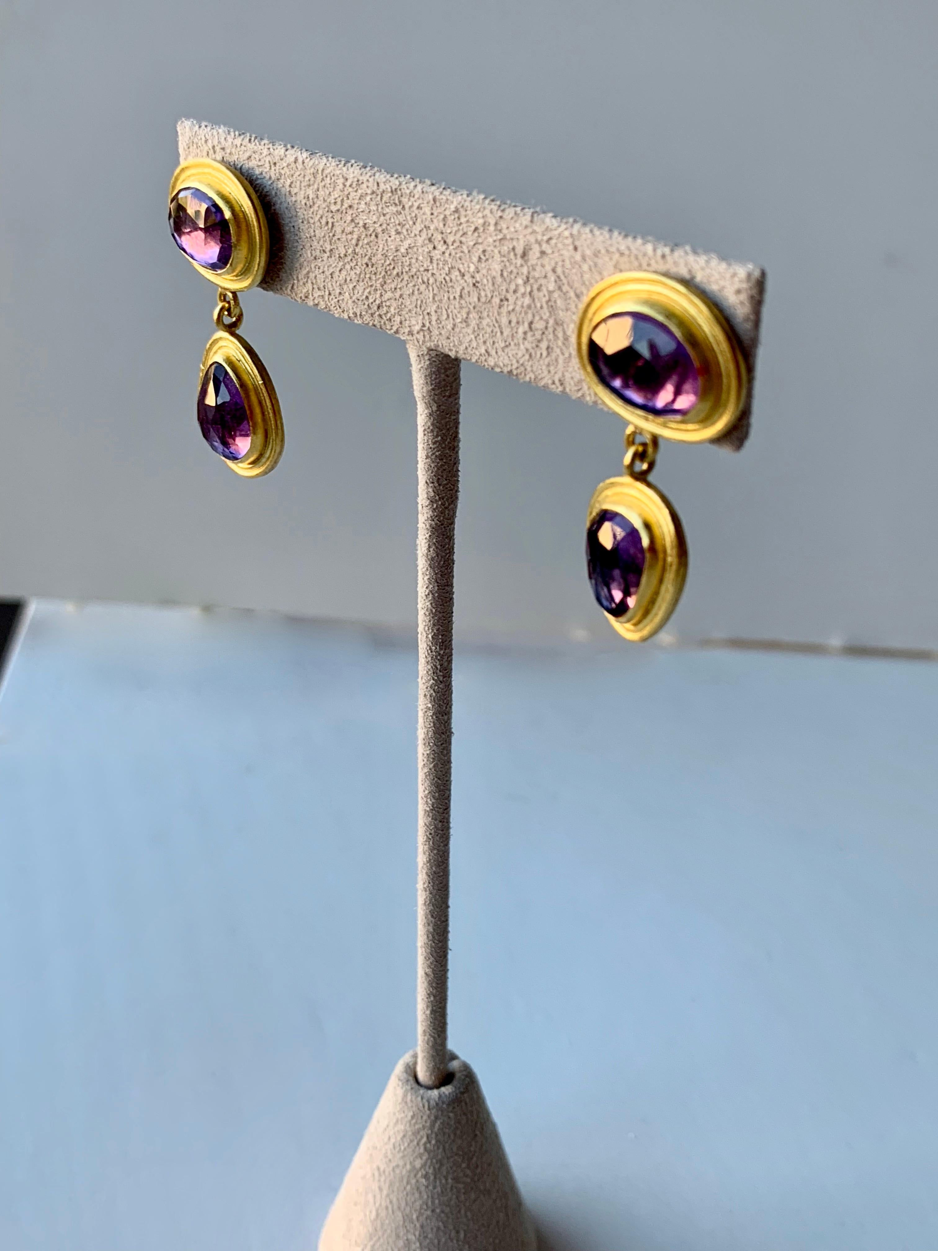 Amethysts were revered by the Ancient Greeks and Romans as a stone symbolizing luxury and were often highlighted as a part of their crowns, scepters, and rings. Free form Amethyst rose cut dangle earrings. Stones set in 22 karat gold with platinum