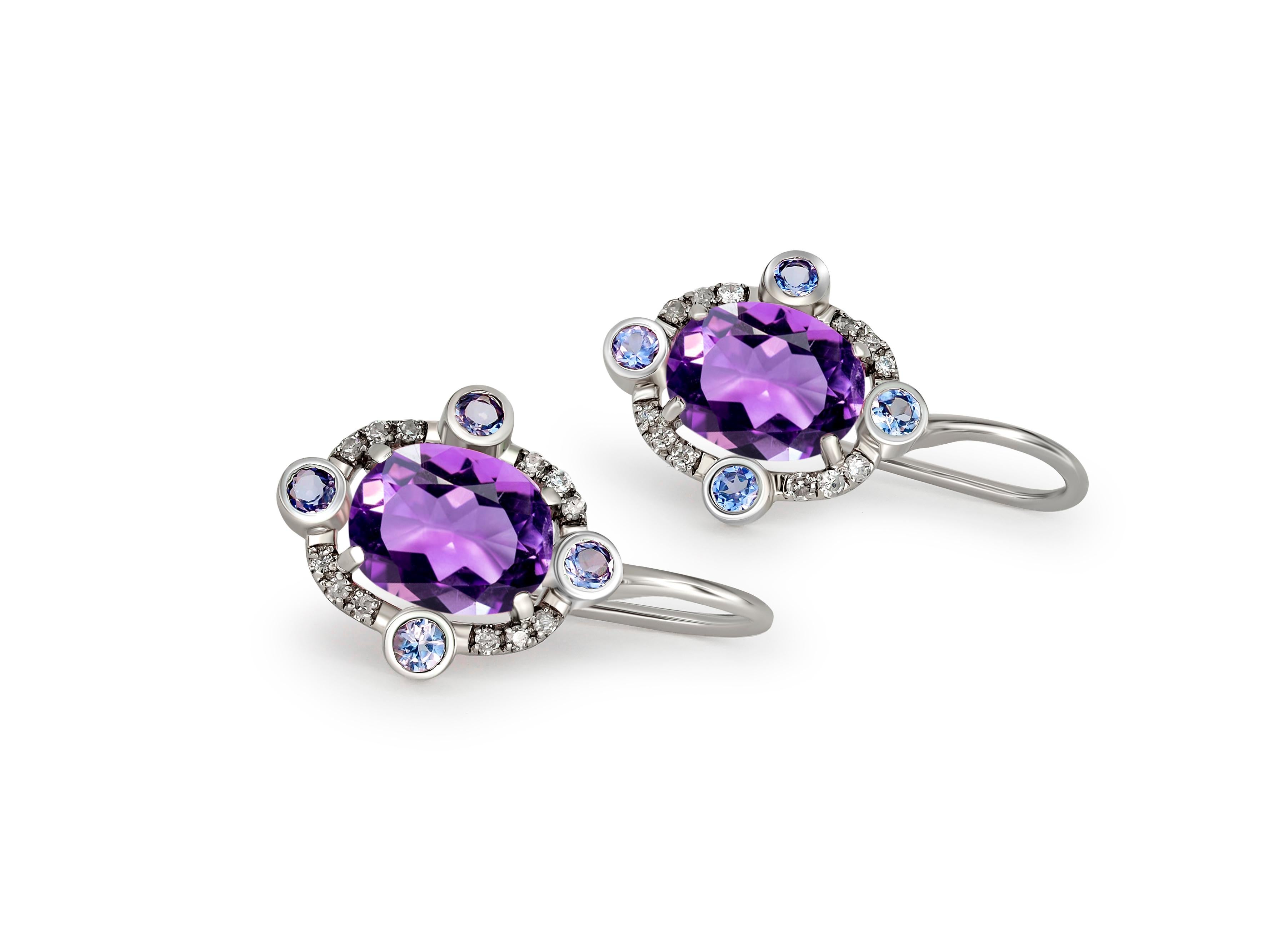 Amethysts 14k gold drop earrings.
Oval amethyst 14k gold earrings. 14 kt gold earrings with amethysts, sapphires and diamonds. February birthstone earrings. 

Gold - 14 kt gold 
Size: 20x12 mm 
Weight: 2.50

Central stones: 
Amethysts, 2 pieces,