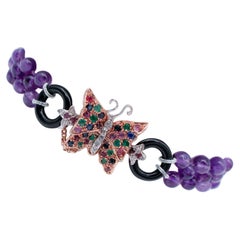 Bracelet en or et argent 9 carats avec amthystes, diamants, meraudes, saphirs et onyx