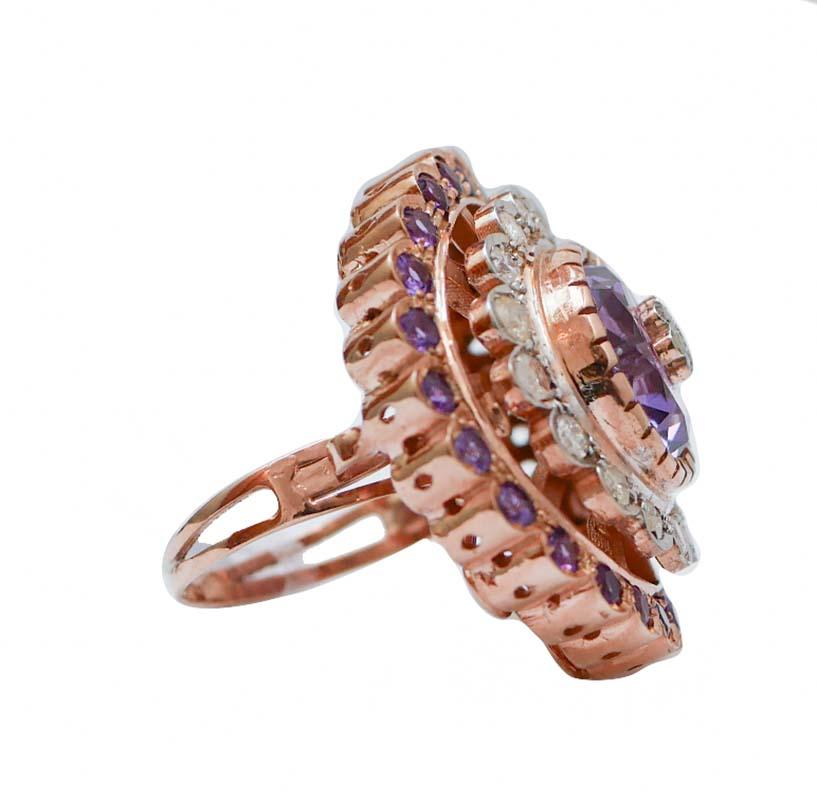 Fantastic ring in 9 kt rose gold and silver structure mounted with a central amethyst with a little flower of diamonds. All around, diamonds and amethysts.
This ring was totally handmade by Italian master goldsmiths and it is in perfect