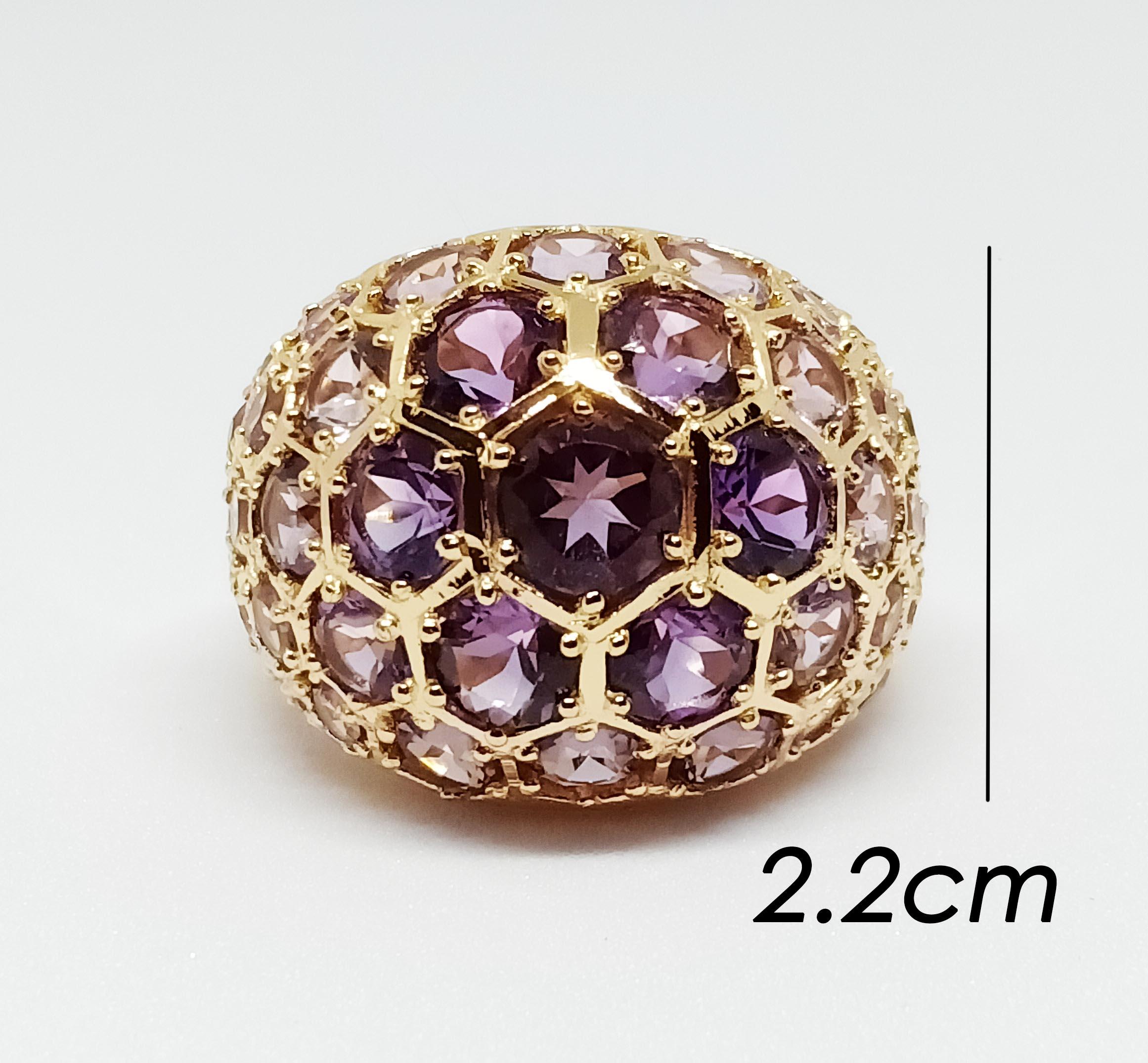 Amethyst Dome Ring. (9.1 cts) Dark to light.
Amethyst Round 6 mm. 1 pc.
Amethyst Round 5 mm. 6 pcs.
Amethyst Round 4 mm. 12 pcs.
Amethyst Round 2.5 mm 10 pcs..
Amethyst Round 3.0 mm. 10 pcs.
Over sterling Silver in 18k Gold Plated.
Can be smaller