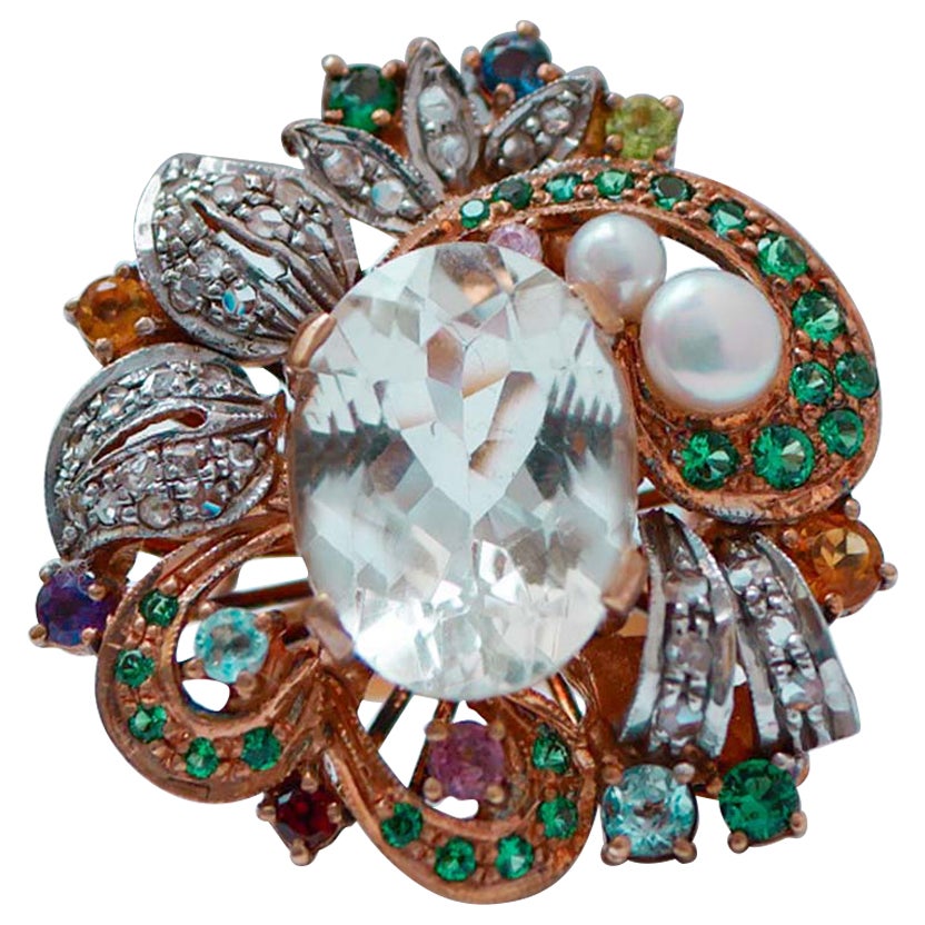 Anello con ametiste, spinello, topazio, diamanti, oro rosa 14 carati e argento.