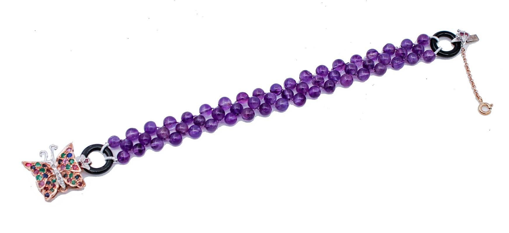 SHIPPING POLICY: 
No additional costs will be added to this order. 
Shipping costs will be totally covered by the seller (customs duties included).

Beautiful bracelet mounted with a intersection of amethyst spheres, two onyx ring as extremes and,
