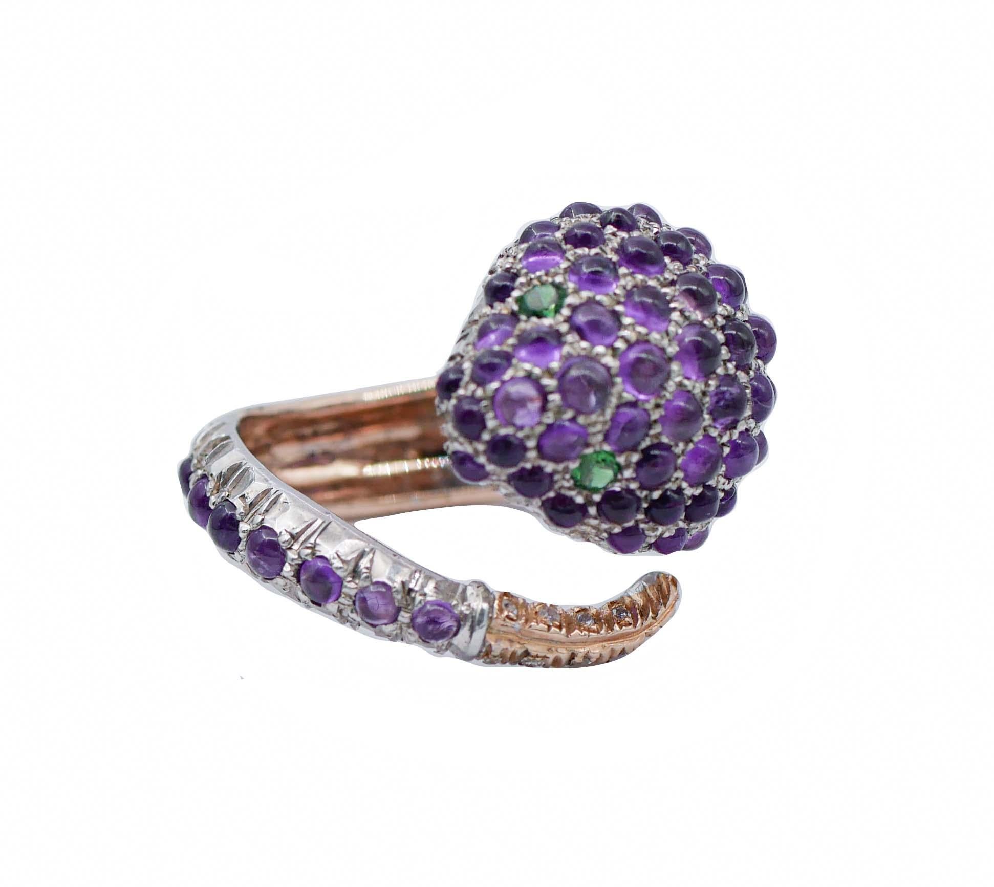 Beautiful snake-shaped ring in 9kt rose gold and silver structure, studded with amethysts on the body, two green stones as eyes and diamonds on the tail.
This ring was totally handmade by Italian master goldsmiths and it is in perfect
