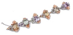 Bracelet en or blanc et améthystes, topaze, améthystes vertes, péridots