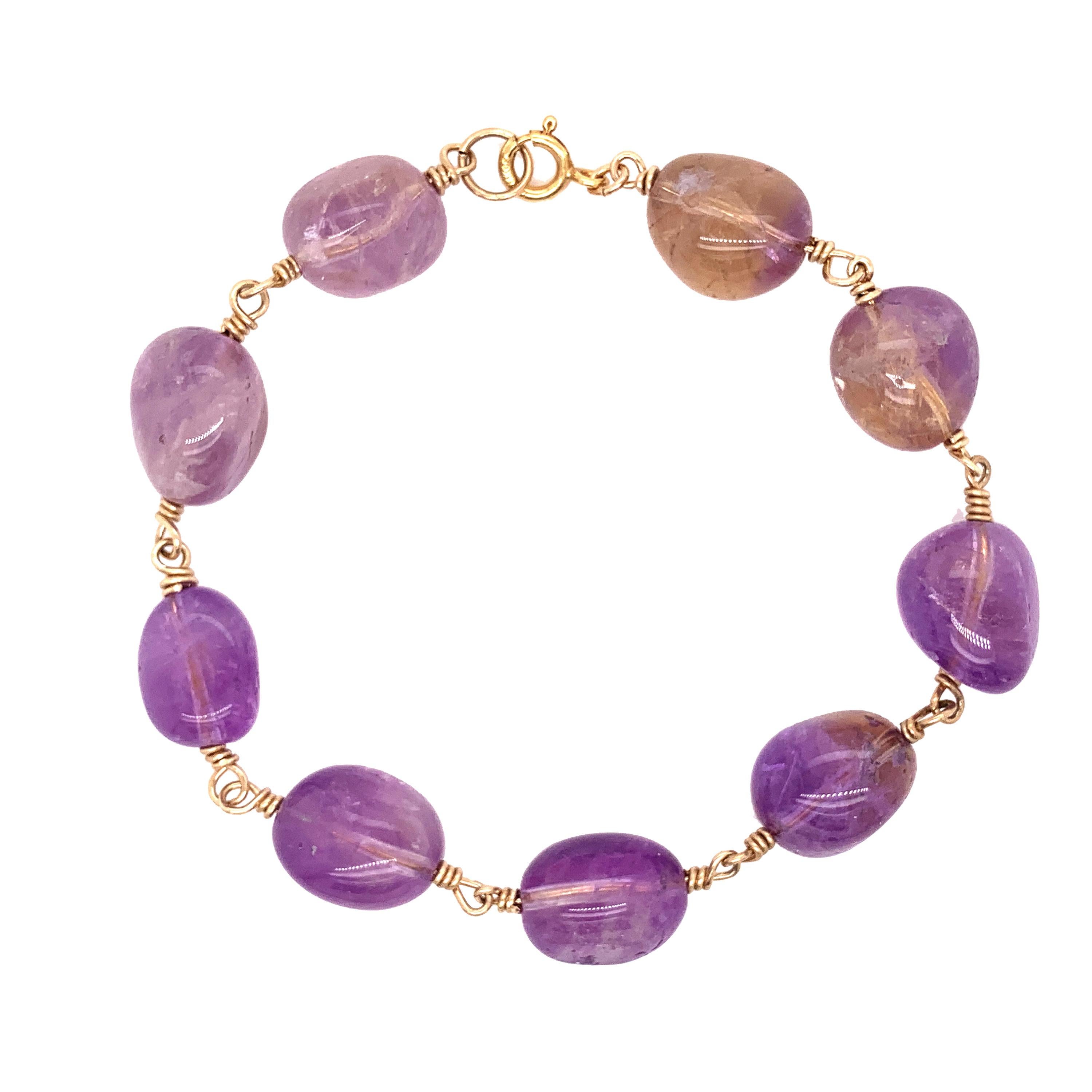Smooth Ametrine beads in colors of purples and hints of yellows make up this bracelet with 14K gold fill wire and 14K gold fill spring ring closure.

These beads measure around 3/4
