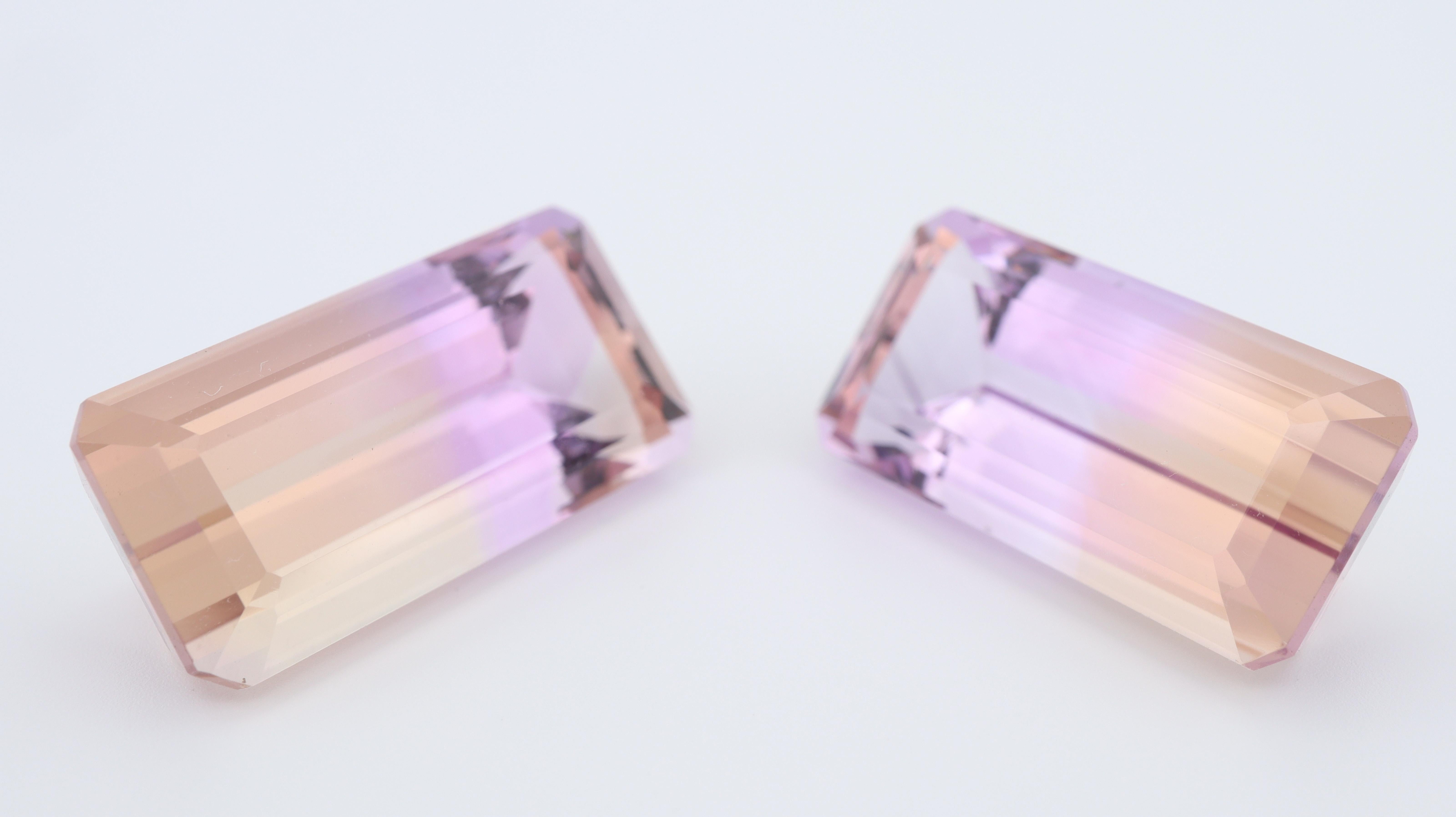 A large pair of Ametrines with well defined color zoning. 
This is a well selected pairs and the color zoning is homogenous in both stones, with a very distinctive colors and excellent saturation.

Ametrines are a natural variety of quartz, and a