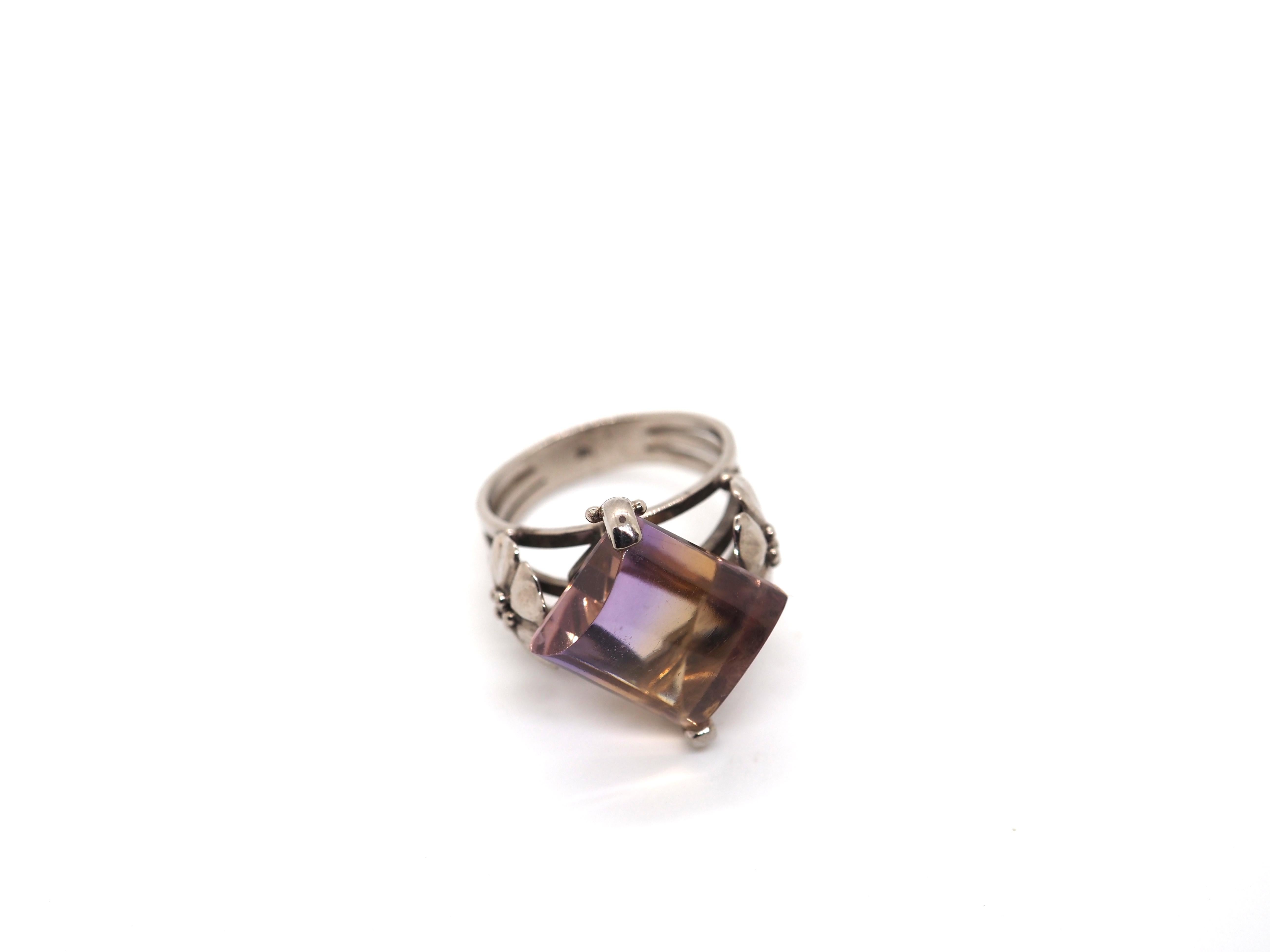 This beautiful ring is crafted in 18 Karat white gold and features an exquisite Ametrine stone. The Ametrine stone is a unique gemstone that features a combination of two colors, purple and yellow. The stone is cut in a faceted shape, which allows