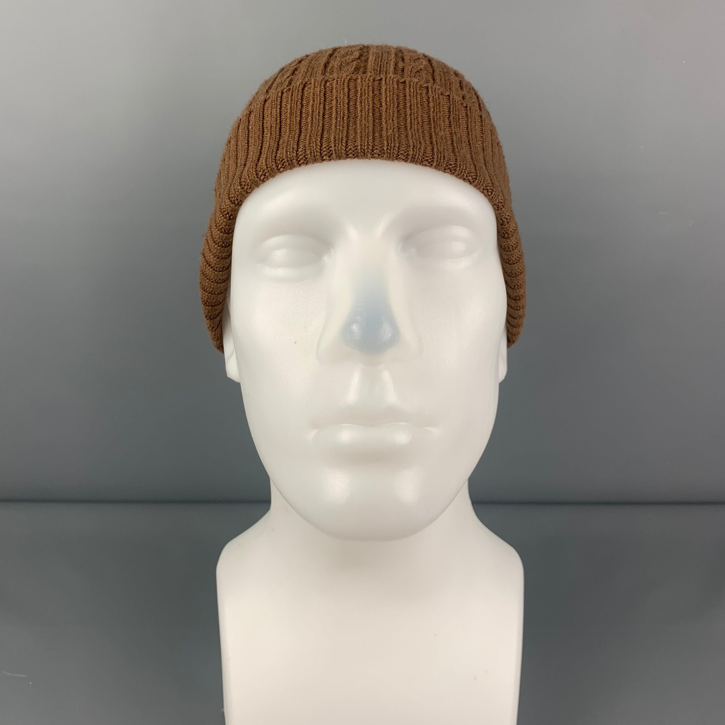 AMI by ALEXANDRE MATTIUSSI beanie comes in a brown knitted wool. Made in Italy.
 Very Good
 Pre-Owned Condition. 
 

 Marked:  Size tag removed.  
 

 Measurements: 
  Opening: 20 inches Height: 9.5 inches 
  
  
  
 Sui Generis Reference: 103185
