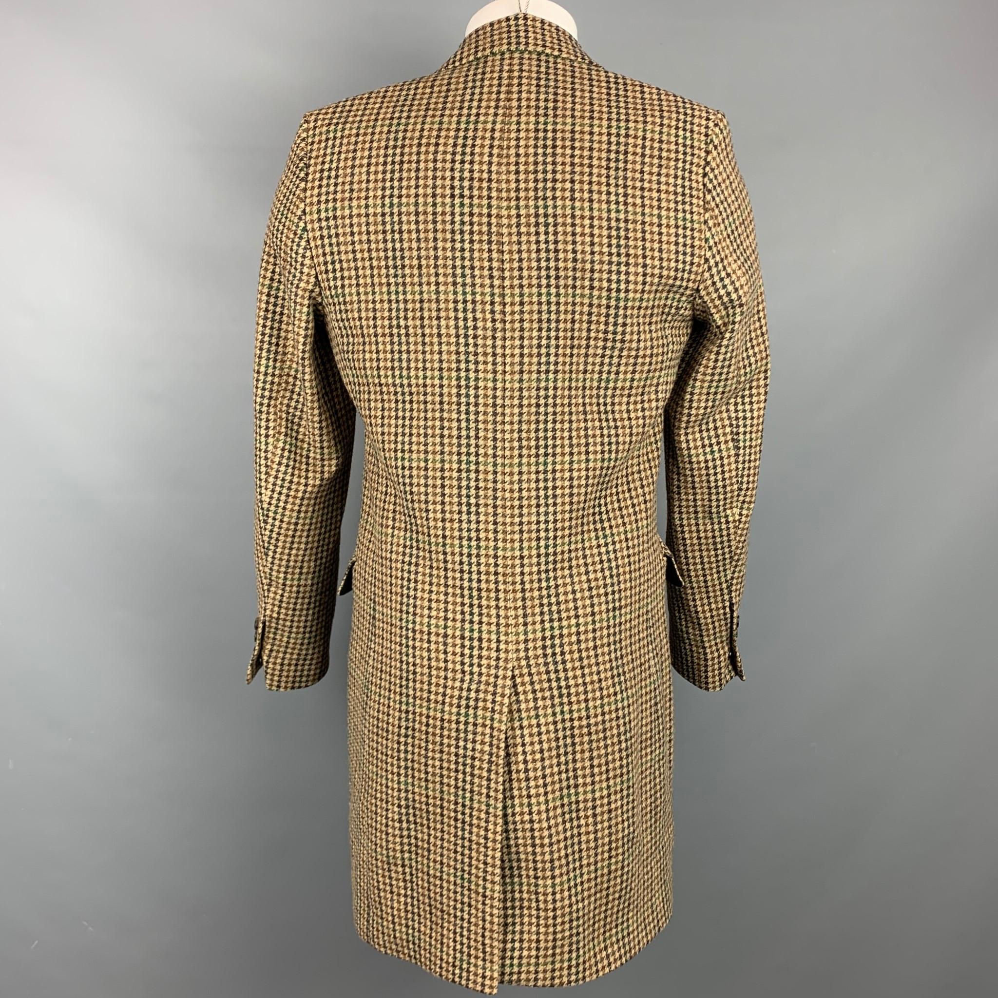 AMI by ALEXANDRE MATTIUSSI coat comes in a tan & brown plaid wool with a full liner featuring a notch lapel, flap pockets, and a two button closure. 

Very Good Pre-Owned Condition.
Marked: FR 50

Measurements:

Shoulder: 16.5 in.
Chest: 40