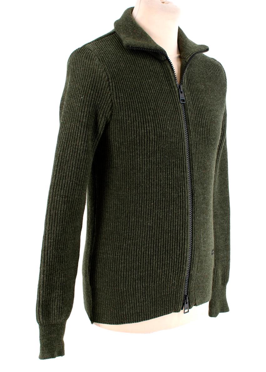 Ami Dark Green Zip-Front Knitted Sweater
 

 - Mid-weight ribbed deep green zip-through sweater with funnel neck and long sleeves 
 

 

 Materials 
 100% Wool 
 

 Made in France 
 Hand-wash
 

 PLEASE NOTE, THESE ITEMS ARE PRE-OWNED AND MAY SHOW