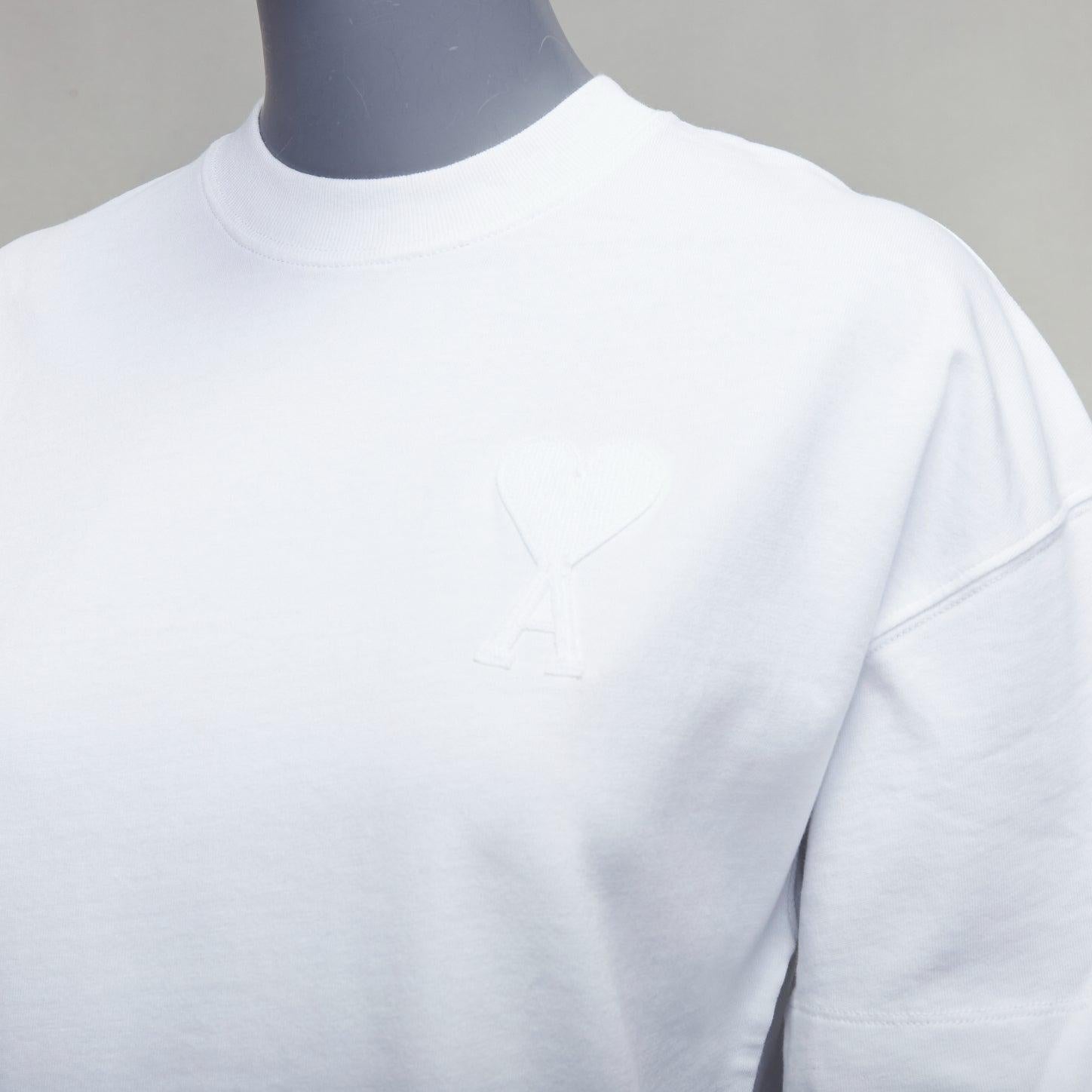 AMI white cotton embroidered A heart badge logo oversized tshirt US0 XS
Reference: YIKK/A00113
Brand: Ami
Material: Cotton
Color: White
Pattern: Solid
Closure: Pullover
Extra Details: Logo back.
Made in: Portugal

CONDITION:
Condition: Good, this