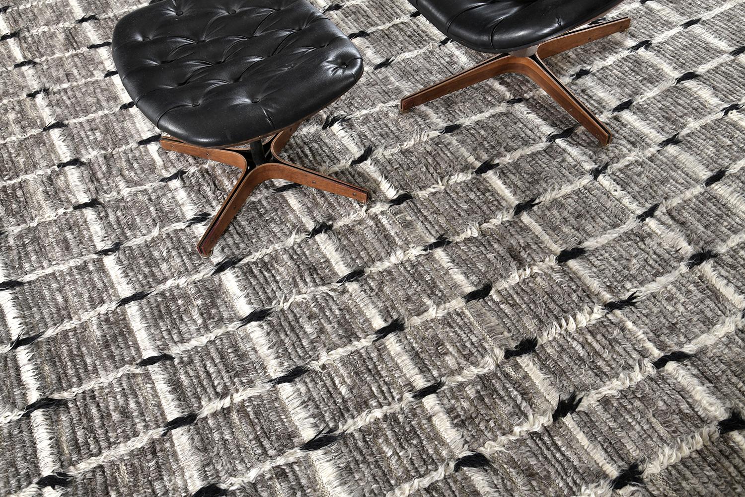 'Amihan' is a beautifully detailed pile weave from our Atlas collection. The delicate checkered and ribbed style rug with earthy charcoal tones give it a rich and charming feel. Designed in Los Angeles with Inspiration from the Moroccan world, this