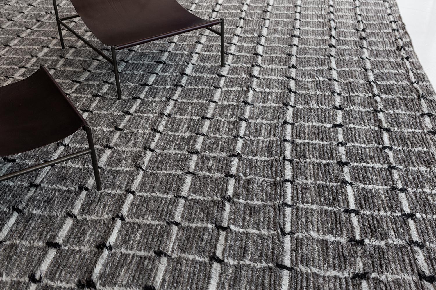Amihan is a beautifully detailed pile weave from our Atlas collection. The delicate checkered and ribbed style rug with earthy charcoal tones give it a rich and charming feel. Repeating black pile detailing also brings a bold and noteworthy