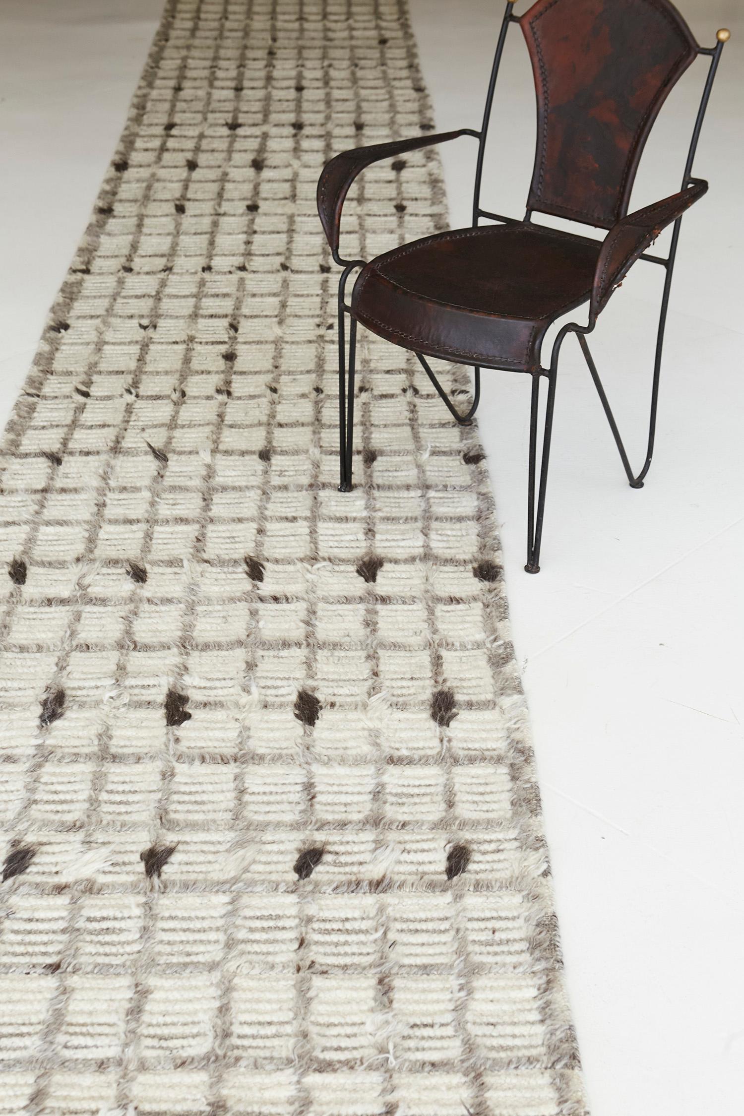 Amihan is a beautifully detailed pile weave from our Atlas Collection. The delicate checkered and ribbed style rug with neutral tones gives a rich and charming feel. Repeating ash pile detailing also brings a bold and noteworthy uniqueness to this