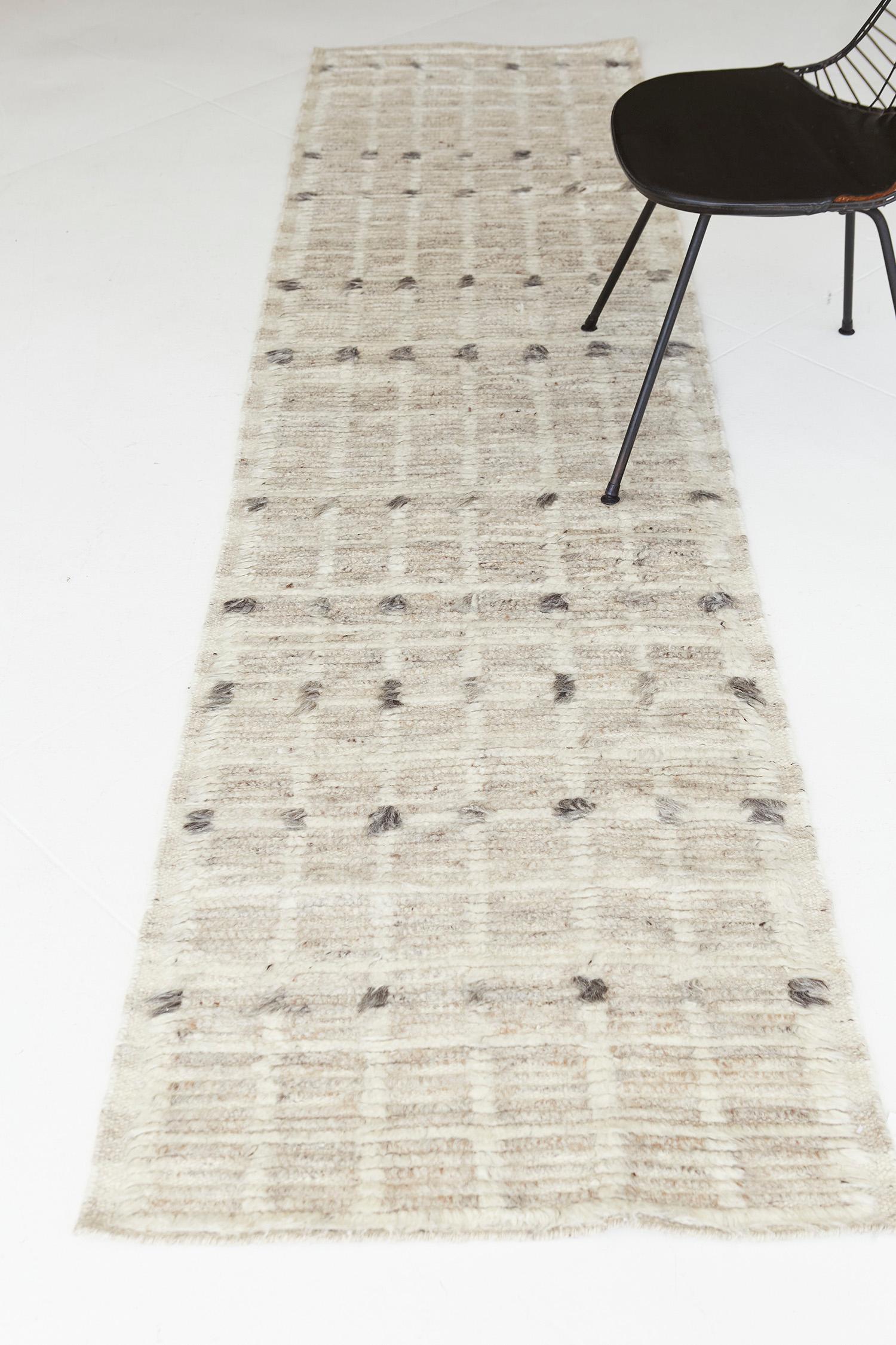 Amihan is a beautifully detailed pile weave from our Atlas Collection. The delicate checkered and ribbed style rug with neutral tones gives a rich and charming feel. Repeating ash pile detailing also brings a bold and noteworthy uniqueness to this