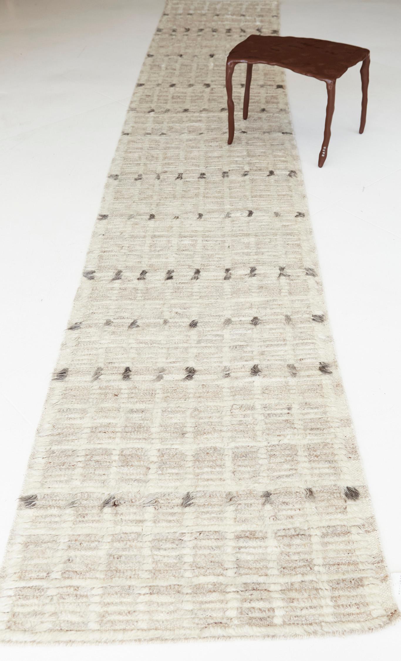 Amihan is a beautifully detailed pile weave from our Atlas Collection. The delicate checkered and ribbed style rug with neutral tones gives a rich and charming feel. Repeating ash pile detailing also brings a bold and noteworthy uniqueness to this