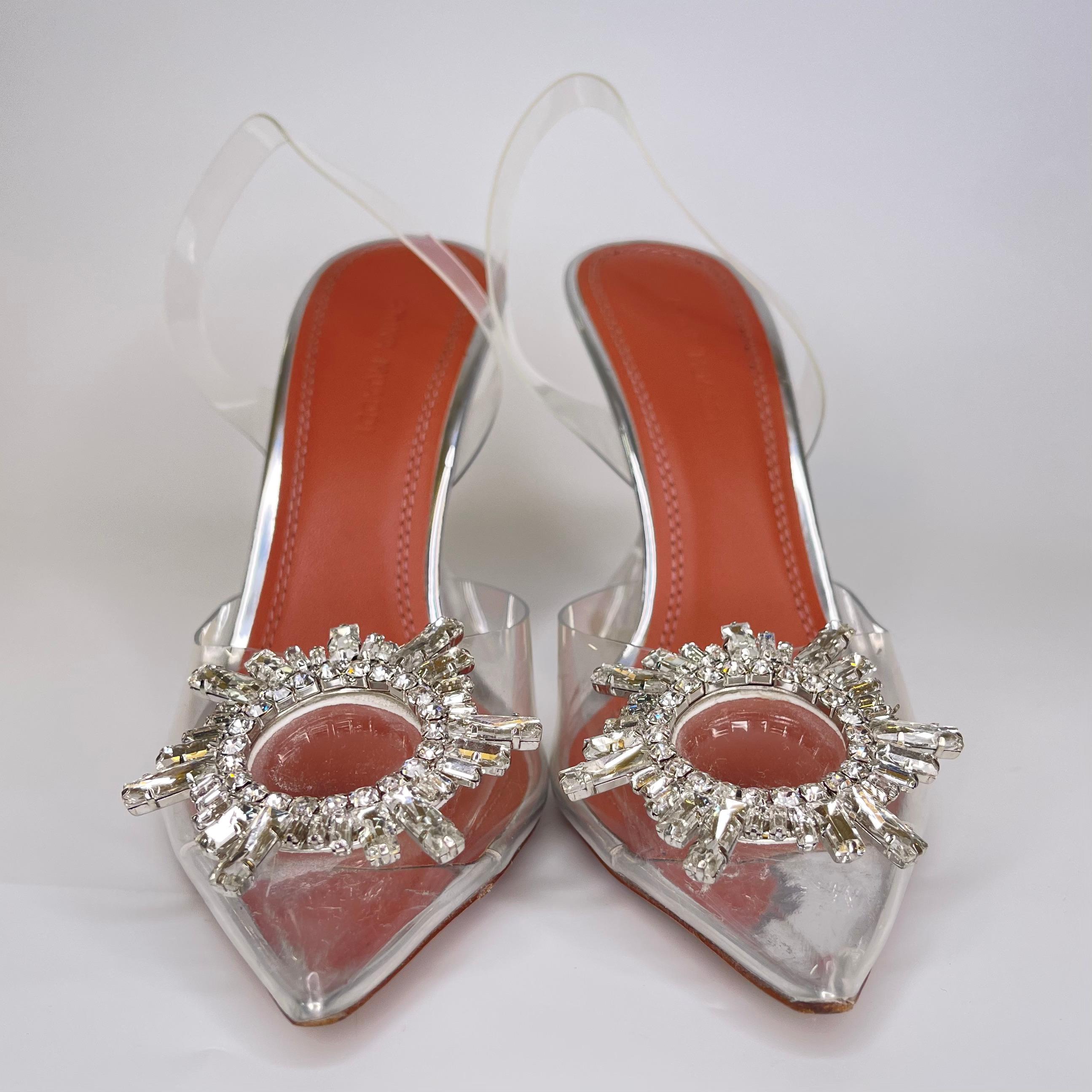 These transparent slingback pumps are the orginal heels by Amina Muaddi. Made from PVC, they feature pointed toes with silver tone and crystal embellishment. This style is set on 95 mm flared stiletto heels.

COLOR: Clear
MATERIAL: PVC
SIZE: 36 EU /