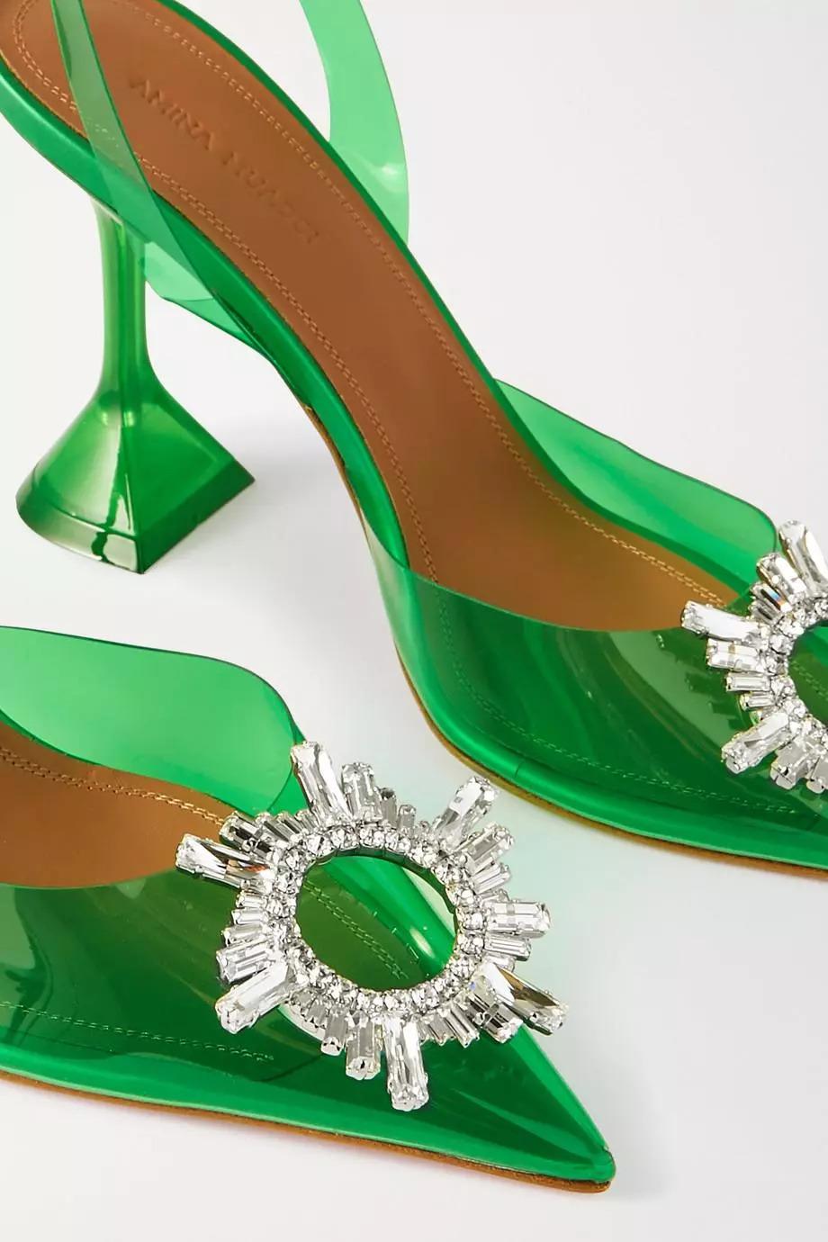 These 'Begum' pumps have been made in Italy from green PVC and set on the label's signature sculpted heel. Coordinate your jewelry with the crystal-embellished sunburst brooch at the toe. 

COLOR: Green
HEEL HEIGHT: 4