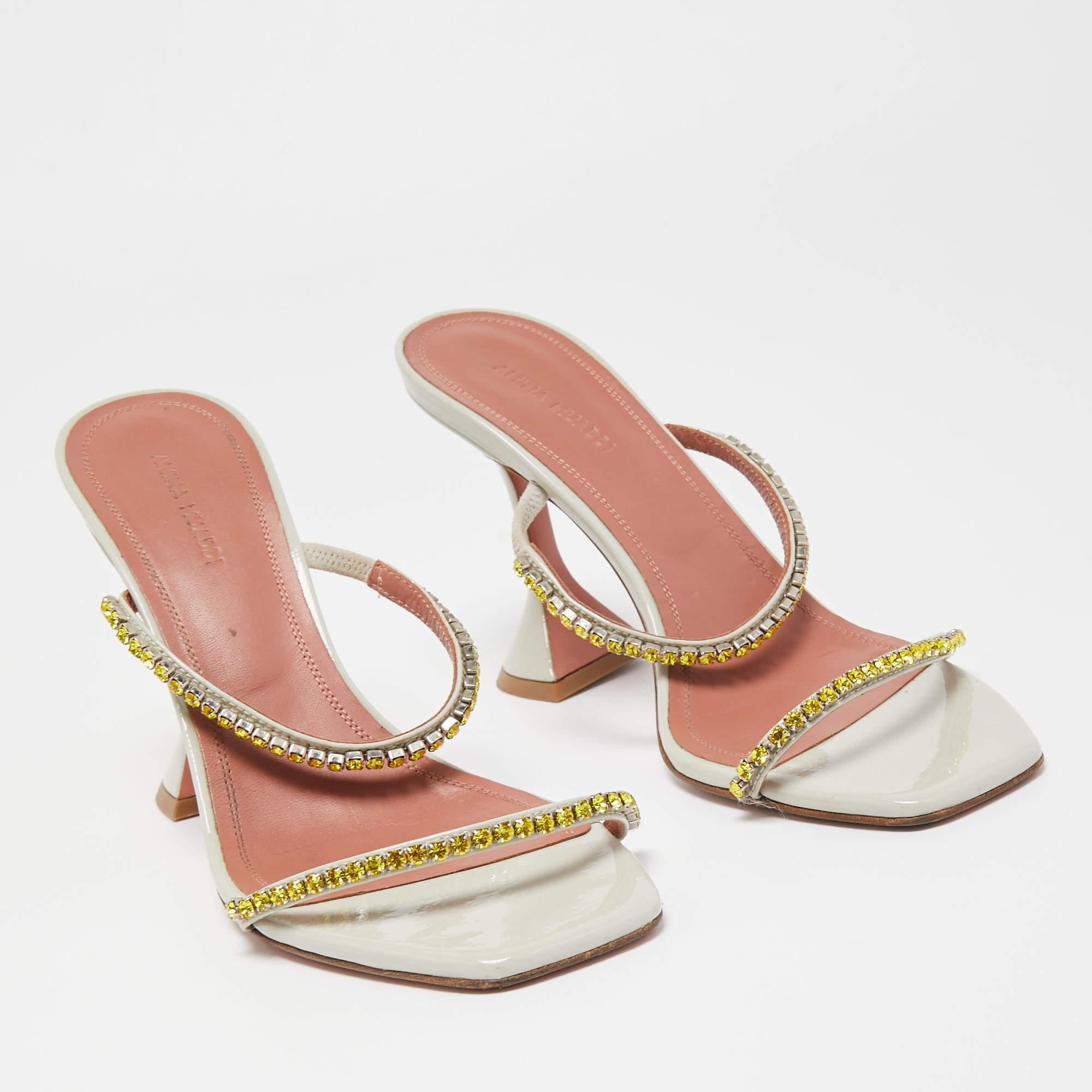 These Amina Muaddi Gilda sandals will frame your feet in an elegant manner. Crafted from quality materials, they display a classy design and comfortable insoles.

Includes: Original Box