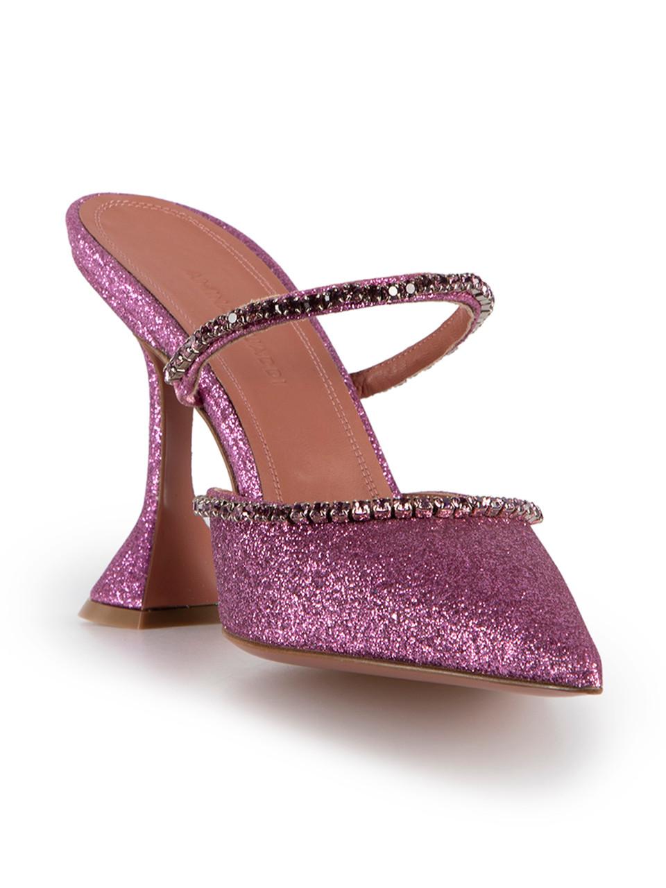 CONDITION is Very Good. Minimal wear to mules is evident. Minimal wear to the left heel with minimal abrasion and the right shoe strap where one crystal has been replaced and glue residue on the back on this Amina Muaddi designer resale item. This