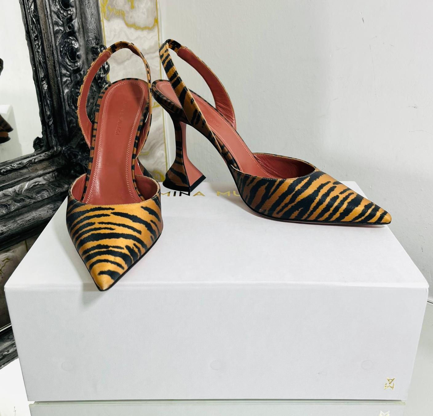 Amina Muaddi Tiger Print Satin Pumps

Heeled 'Holli' pumps designed with tiger print in tan and black.

Detailed with pointed toe and signature martini-shaped heel.

Featuring partially elasticated slingback stripe and leather lining. Rrp £620

Size