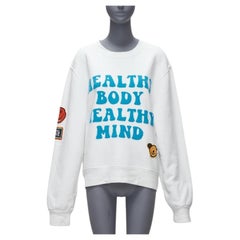 AMIRI 2021 Un movimiento de amor cuerpo sano insignia de punto cara sonriente sudadera blanca L
