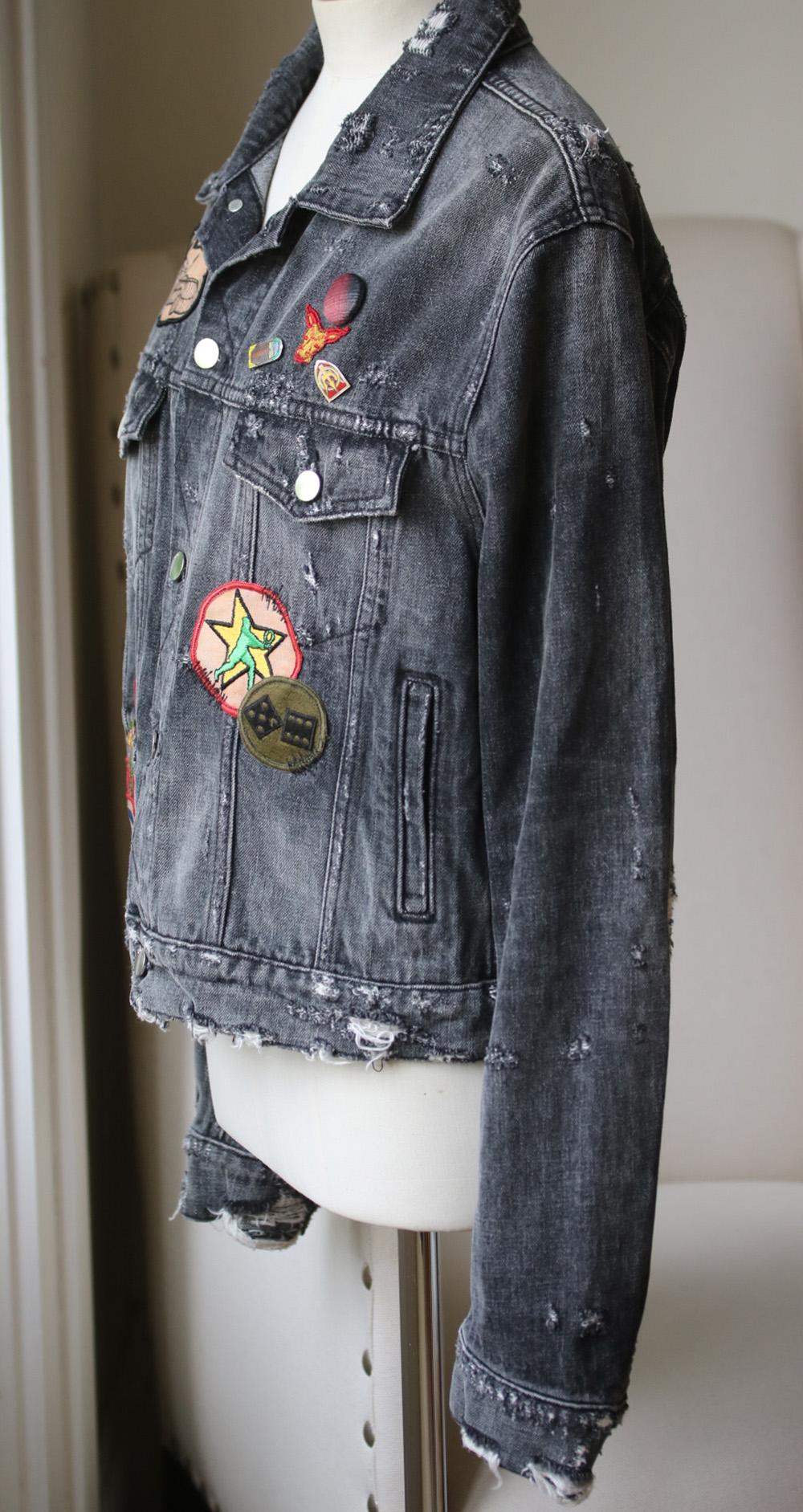 Amiri's denim jacket is designed with distressed sleeves that add a bit of movement.
It's cut from cotton, washed and embellished with appliqué and sting print detail to create a vintage-inspired look.
Black denim.
Button fastenings through