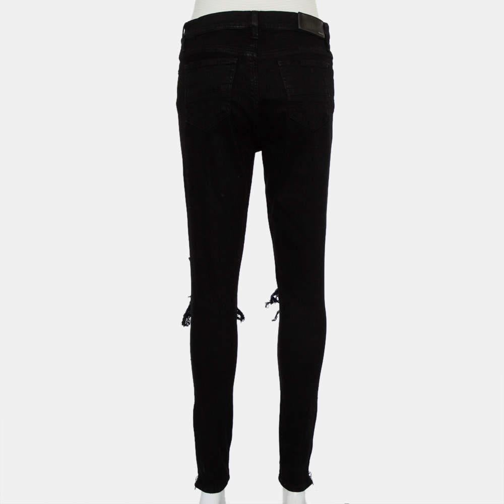 Now style those fabulous T-shirts of yours with these black distressed denim jeans from Amiri. They feature bottom zipper details on the sides and come equipped with a front button and zip fly, belt loops, and five pockets. Wear stylish ankle boots