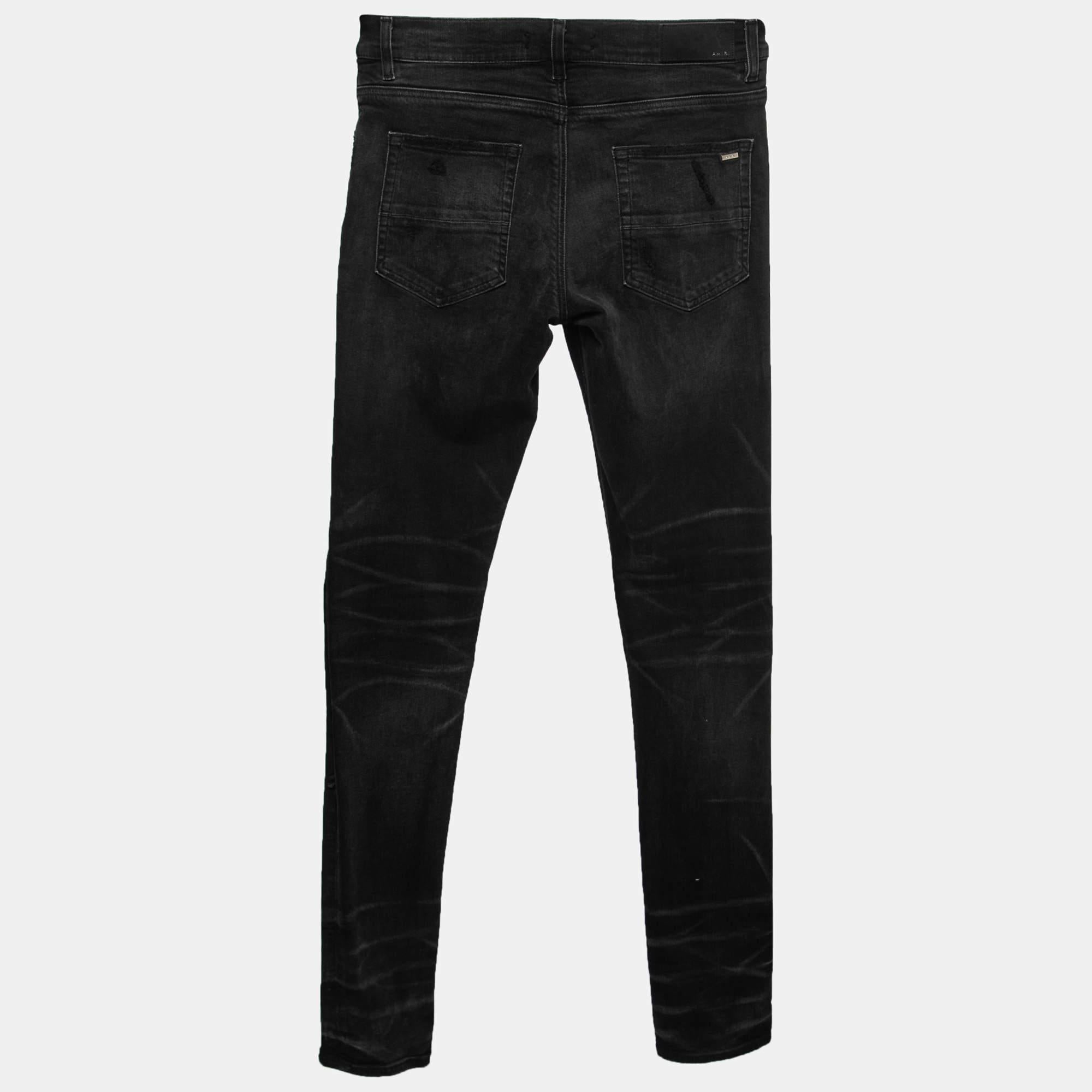 A must-have for your casual wardrobe, these Amiri jeans are made of denim offering a comfortable wearing experience. They carry a black hue with a distressed finish. These well-fitting jeans have multiple pockets and a buttoned closure.

