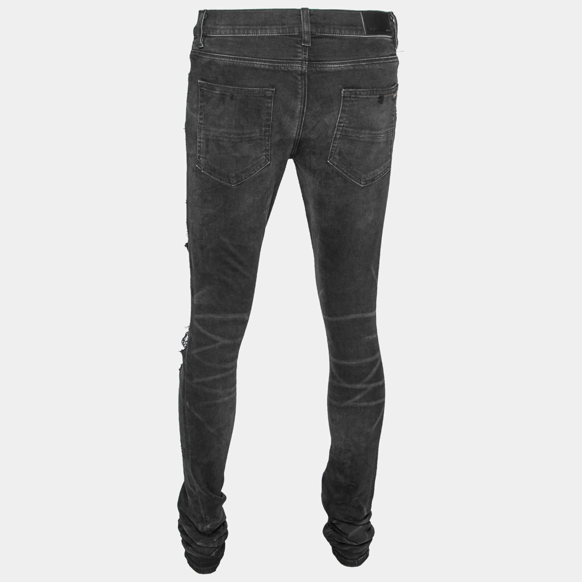 Revamp your wardrobe with these jeans from Amiri! They are created using black cotton fabric, which is enriched with distressed detailing. The jeans are made in a slim-fit style and are provided with a buttoned closure and external pockets.

