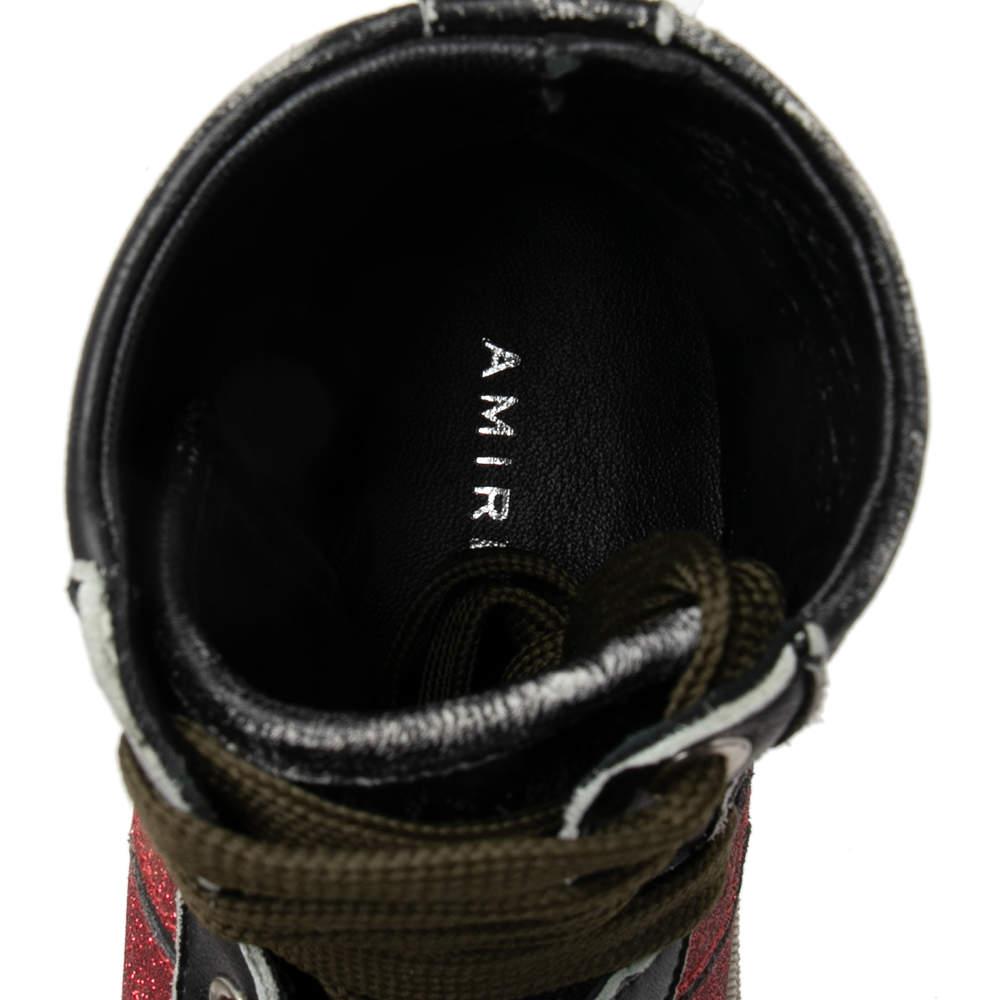 Flaunt your high fashion choices with these luxurious sneakers from the House of Amiri! They have been crafted using black-red glitter and leather with lace-up closure highlighting their vamps. They feature a high-top silhouette. Look trendy and
