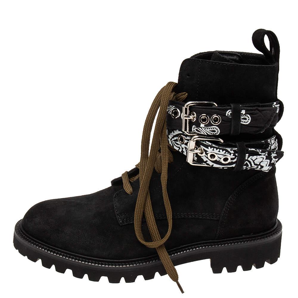 Amiri brings you these super-cool combat boots for you to flaunt. Crafted from suede, the black boots feature eye-catching buckle details and shoelaces. They'll look great with a jacket and fitted jeans.

Includes: Original Box, Price Tag, Original