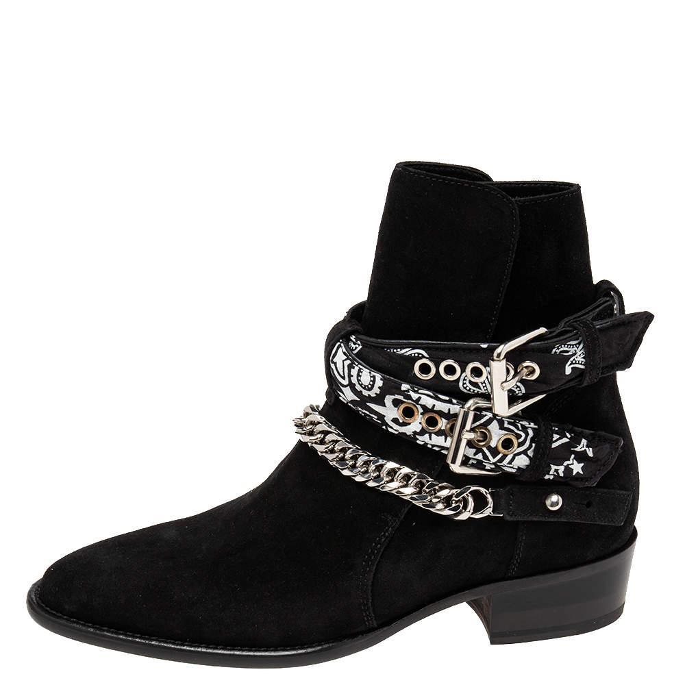 Get ready for your next event wearing these designer ankle boots from Amiri. The black suede exterior, the chain & bandana-print buckled strap details, and the short heels make the boots striking and fashionable.

Includes: Original Box, Original