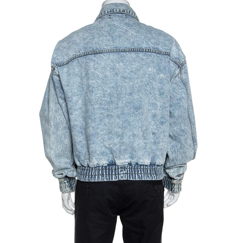 Grab this stylish bomber jacket by Amiri and elevate your casual style instantly. Crafted from 100% cotton, this acid-washed denim jacket comes in a lovely shade of blue. It is styled with a zip front, four pockets, simple collar, fitted trims along