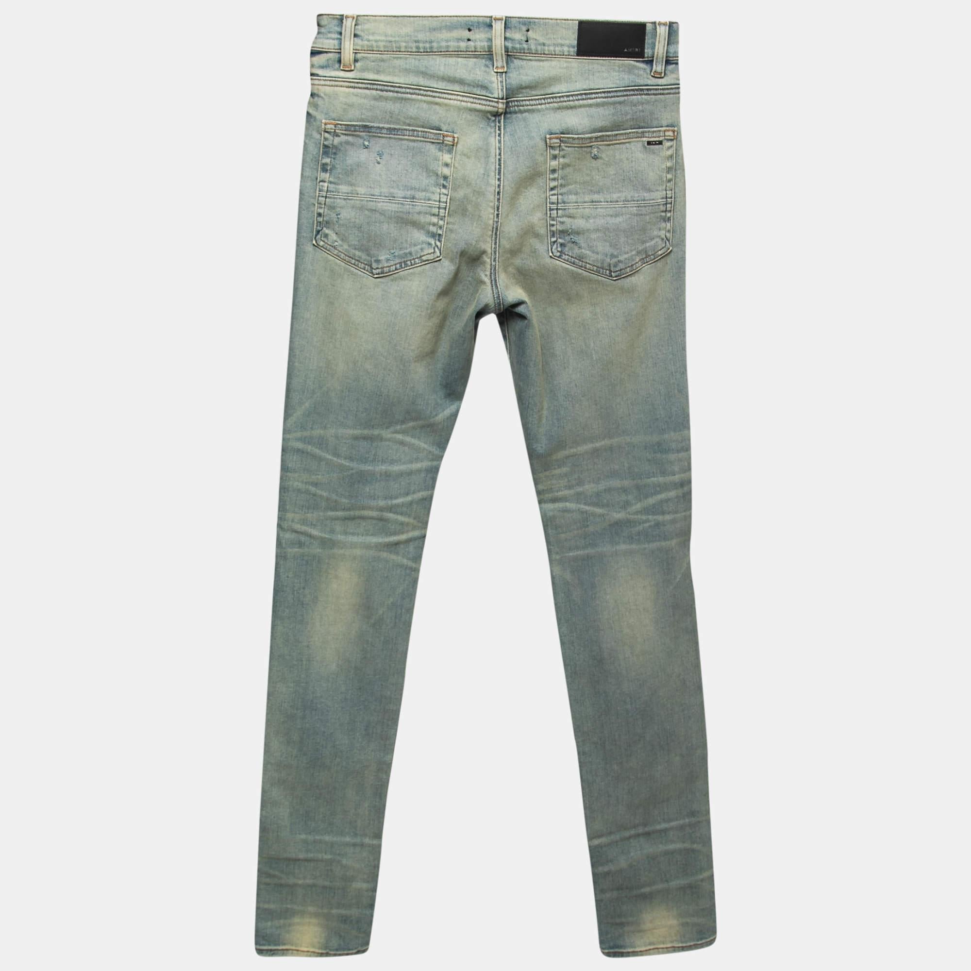 A must-have for your casual wardrobe, these Amiri jeans are made of denim offering a comfortable wearing experience. They carry a blue hue with a distressed finish. These well-fitting jeans have multiple pockets and a buttoned closure.

