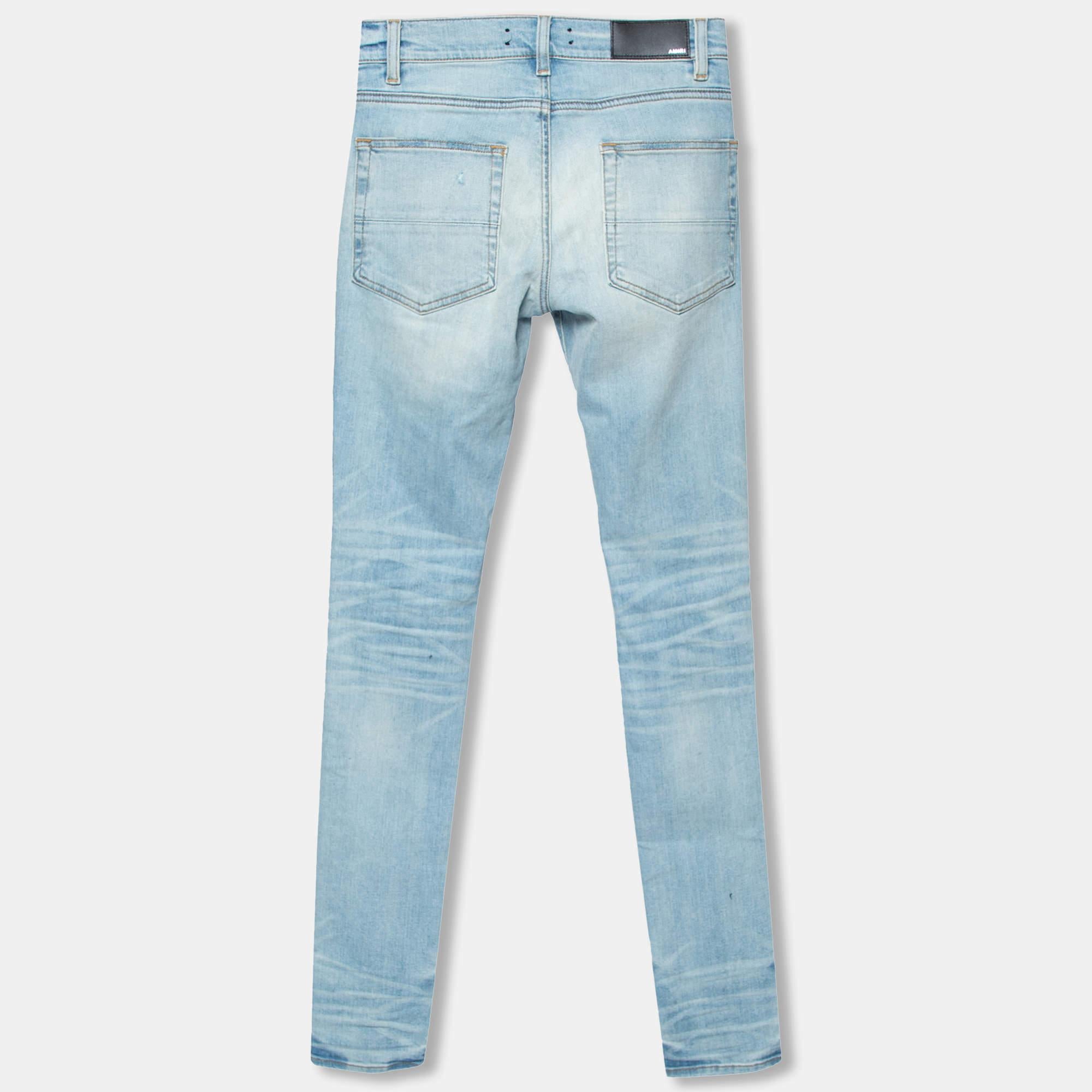 These stunning skinny jeans come from Amiri. They are created using light-wash denim fabric, which is enriched with distressed detailing. They are provided with a zipper closure and five external pockets. These jeans are tailored to offer a good fit