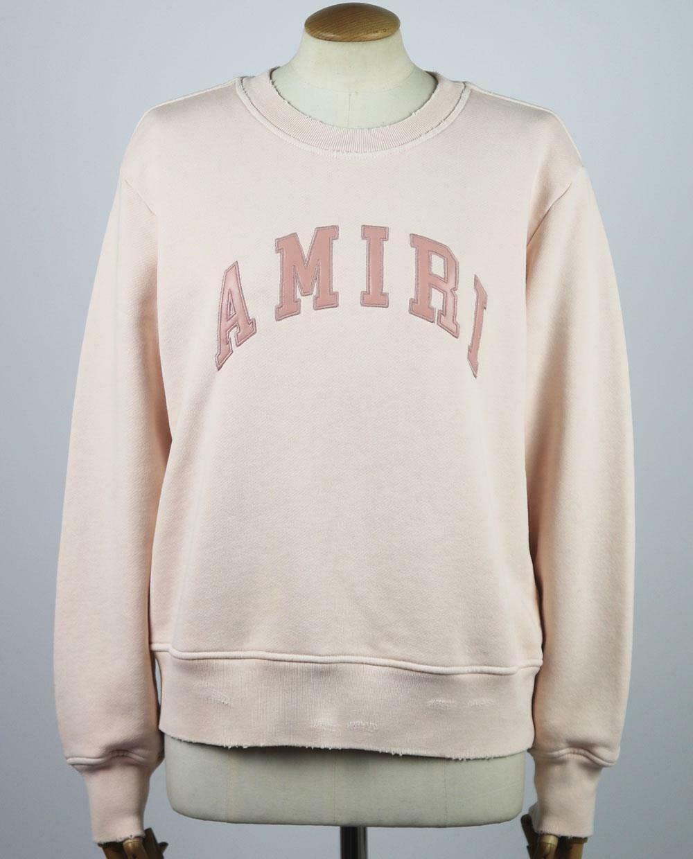 AMIRI's pink sweatshirt is cut from substantial loopback cotton-jersey in a slightly oversized fit that's emphasized by dropped shoulders and wide, slouchy sleeves, it's detailed with the brand's logo in leather.
Pink cotton-jersey, pink