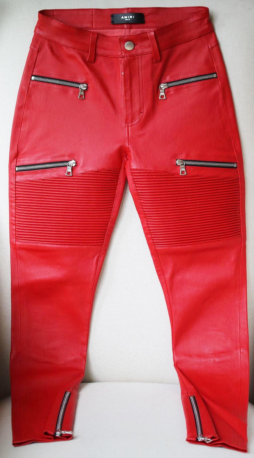 Amiri's Lx1 skinny jeans are crafted of red leather detailed with corrugated panels at the thighs. Sits at waist. Skinny fit. Belt loops. Four zip front pockets. Ankle zips. Leather logo patch and two patch pockets at back. 100% leather. 

Size: W25