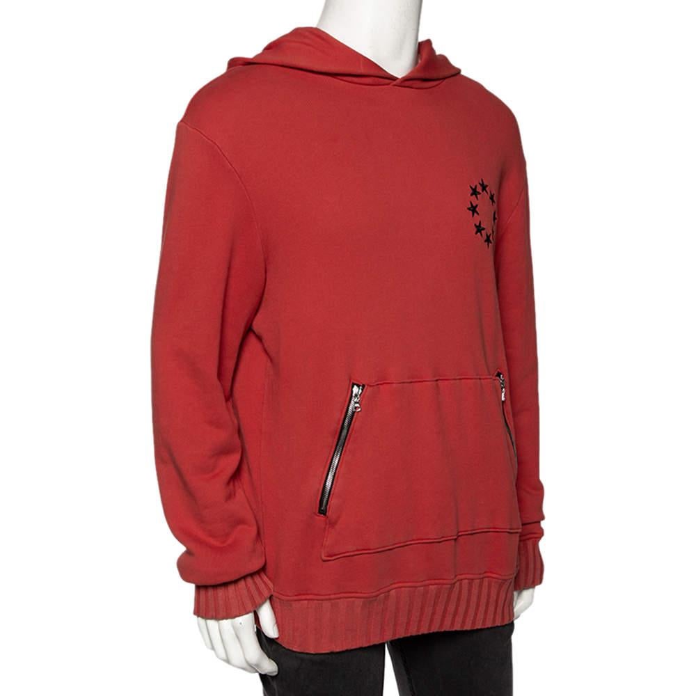 Stylish yet comfortable, this hoodie from Amiri is just what you need to add to your closet. The cotton hoodie flaunts an orange shade and a star circle embroidery on the front left side. It also features long sleeves and two zipper pockets in the