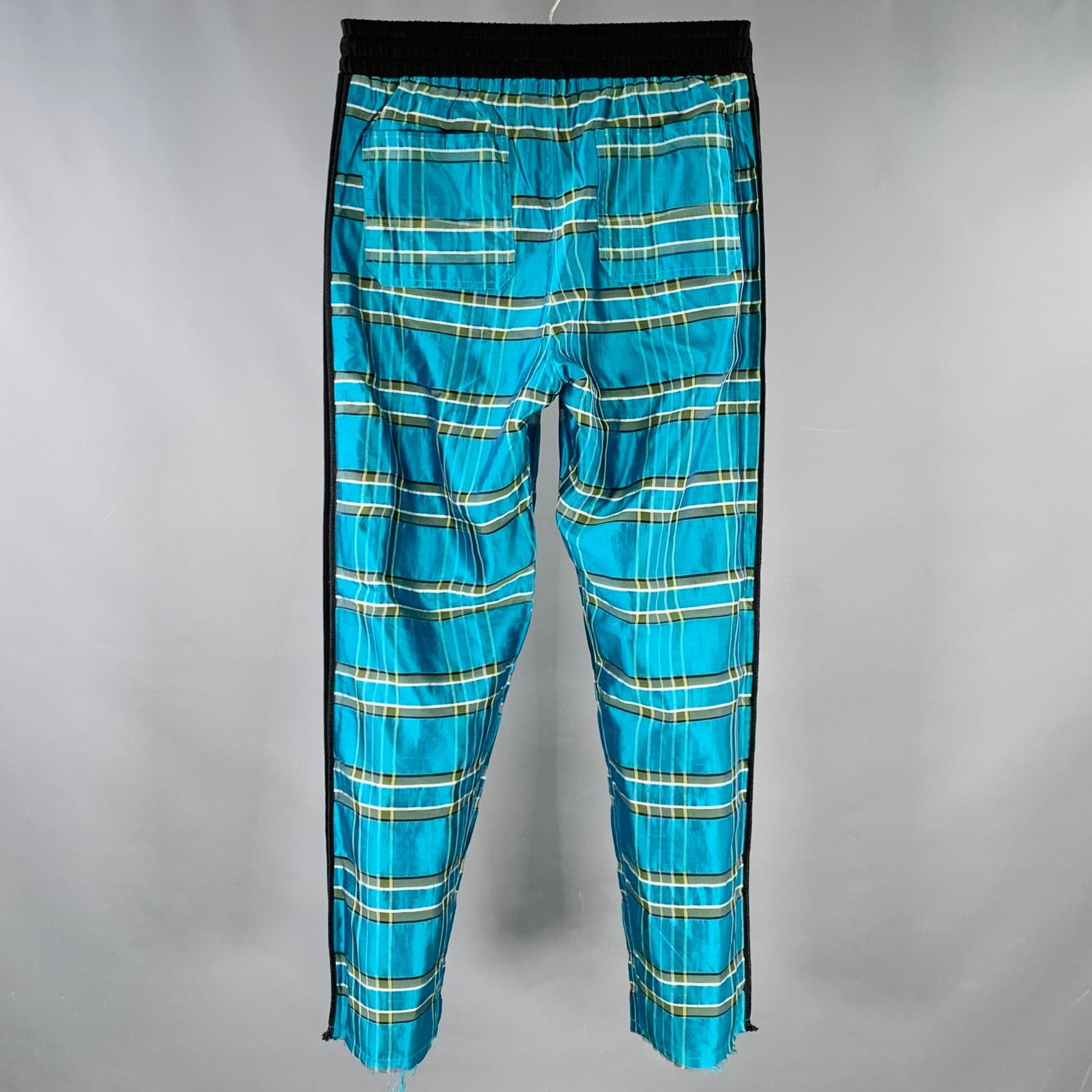 AMIRI casual pants
in a black and turquoise blue silk featuring a plaid pattern, tuxedo-style side stripes, and elastic waistband. Made in USA.Very Good Pre-Owned Condition. This item was consigned without drawstring. 

Marked:   S 

Measurements: 
