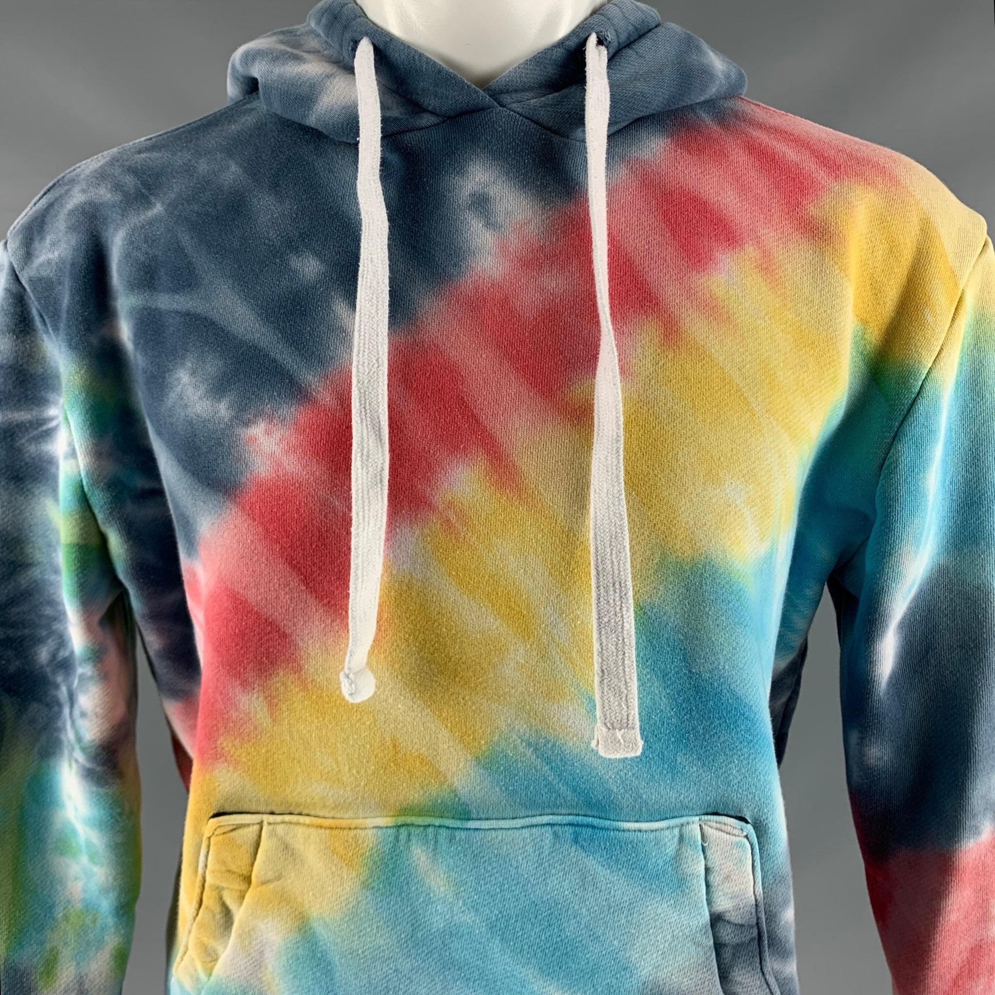 AMIRI sweatshirt
in a multi-color cotton fabric featuring a hoodie style, vibrant tie dye, white star arm details, and kangaroo pockets. Made in USA.Very Good Pre-Owned Condition. Minor pilling. 

Marked:   S 

Measurements: 
 
Shoulder: 21 inches