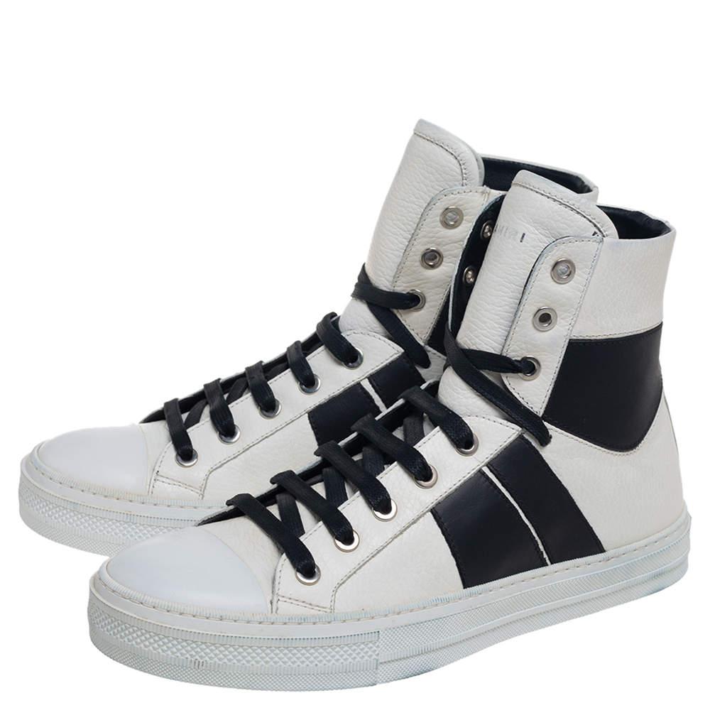 Complement your casual look with these high-top sneakers from the house of Amiri! Crafted from white and black leather, these sneakers have a minimal design, simple laces, and durable soles for lasting wear.

