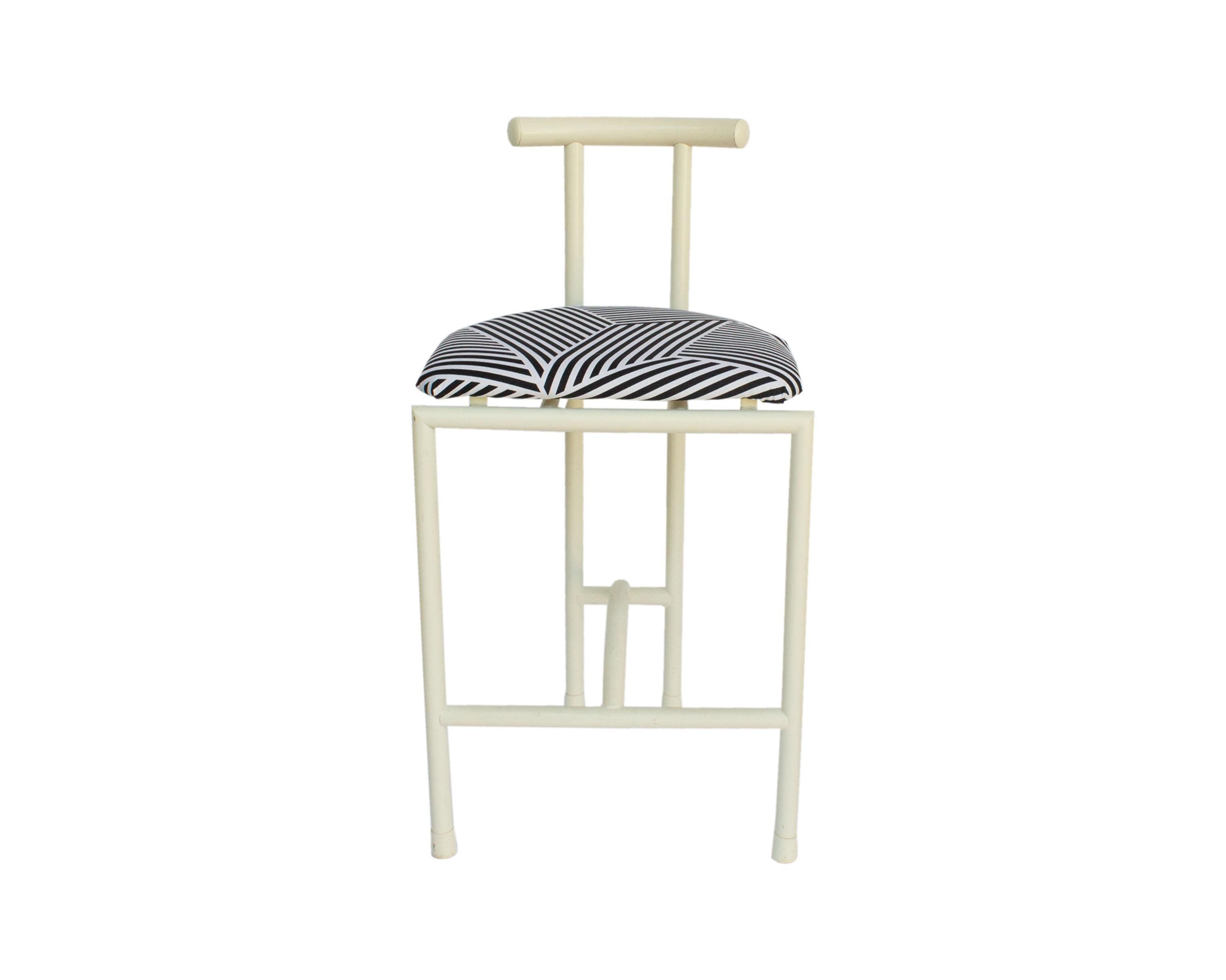 A set of four Postmodern Tokyo counter stools by Amisco. Made in 1989, the stools are made from a white tubular metal that create an overall sleek design. Black and white geometric fabric covers each of the seats. Several of the chairs have their