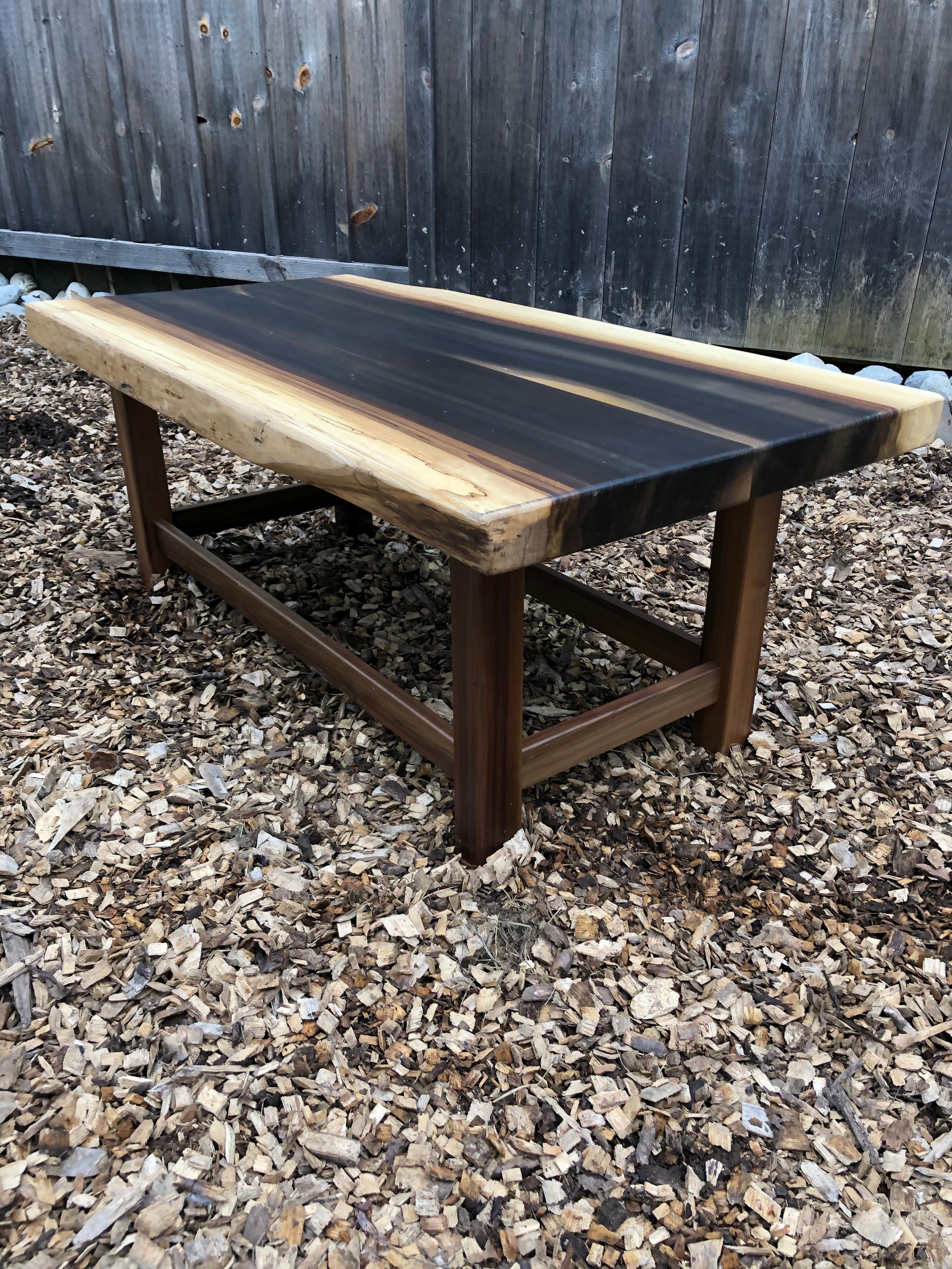 Great looking organic modern coffee table made of beautiful grained poplar in a solid slab with live edges.
