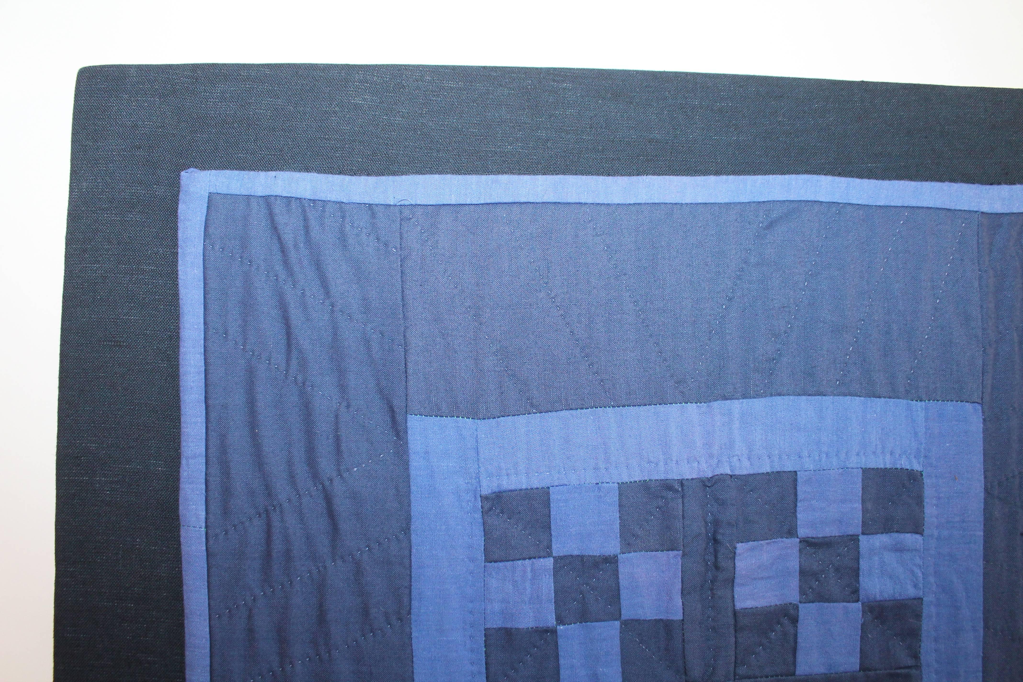 This most unusual deep royal blue back round with a robin egg blue chain in cotton. This Ohio Amish crib quilt is in fine condition and is mounted on a stretcher frame ready for hanging. Great piece of work and colors.